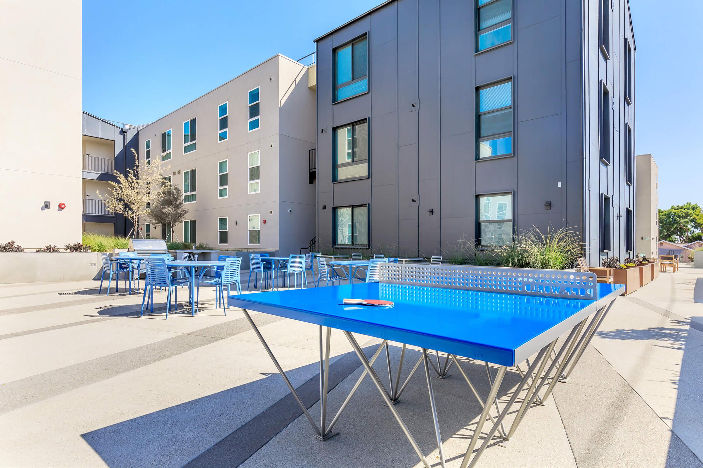 a building with a blue umbrella