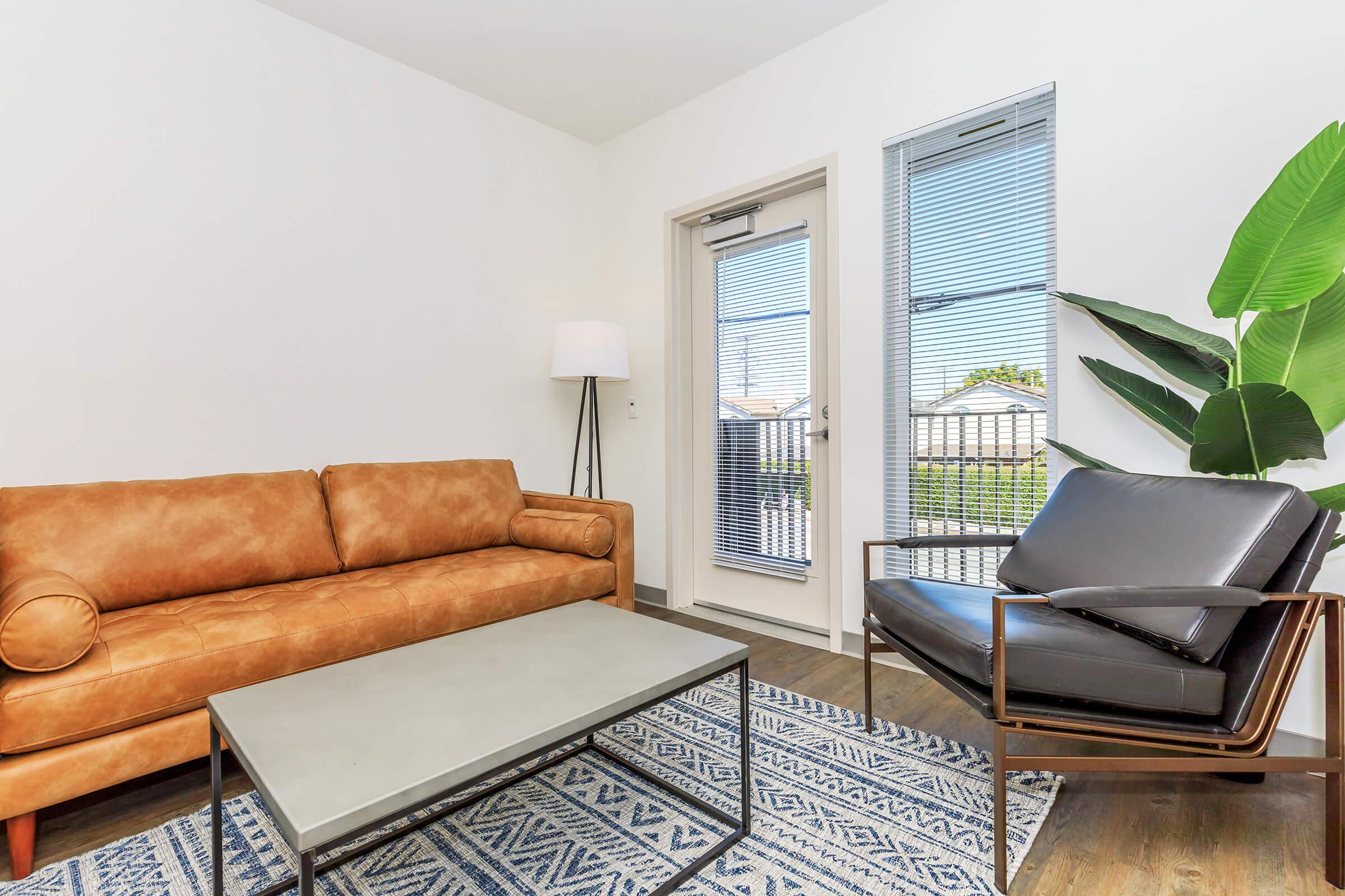 a living room with a leather chair