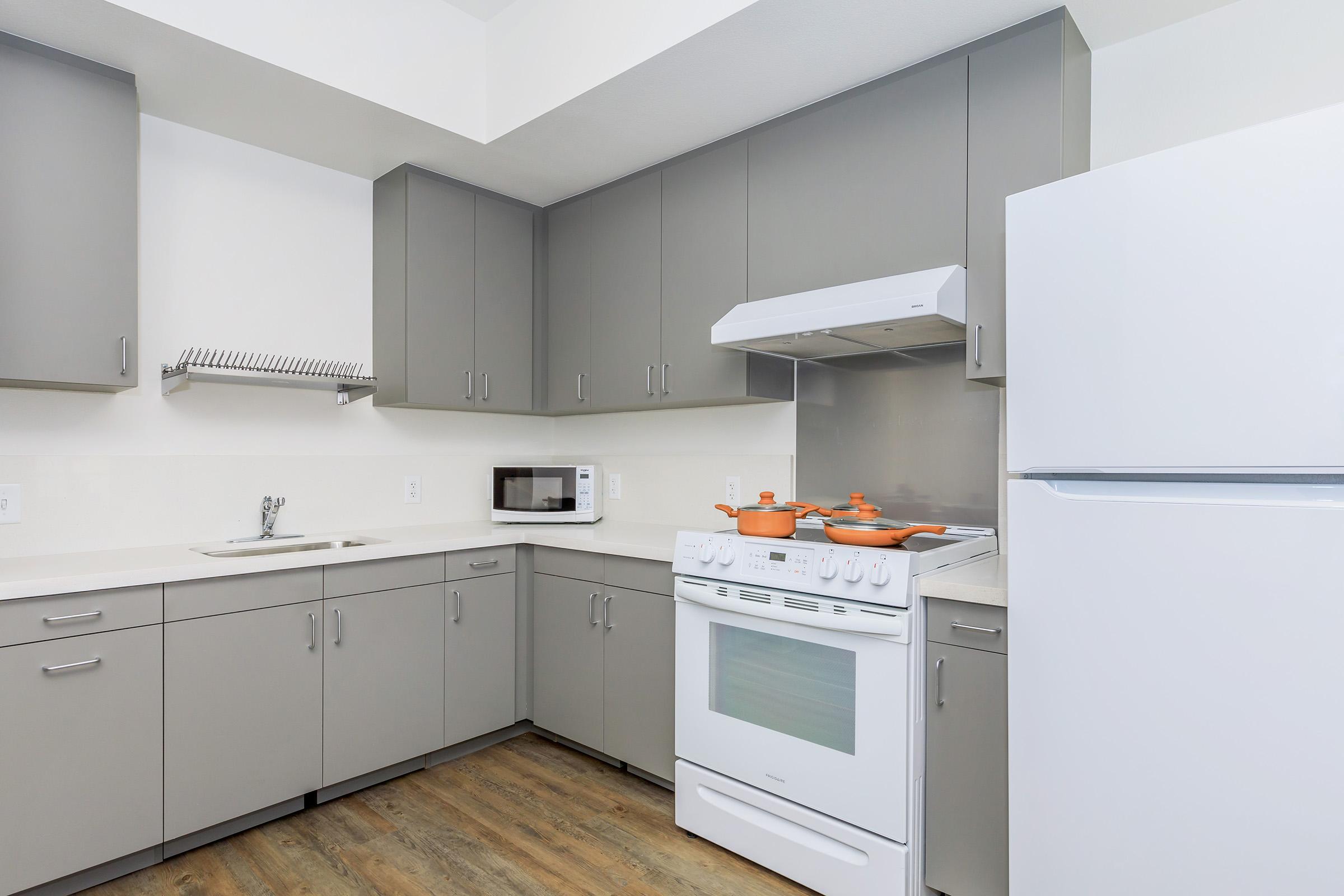 a kitchen with a stove and a refrigerator