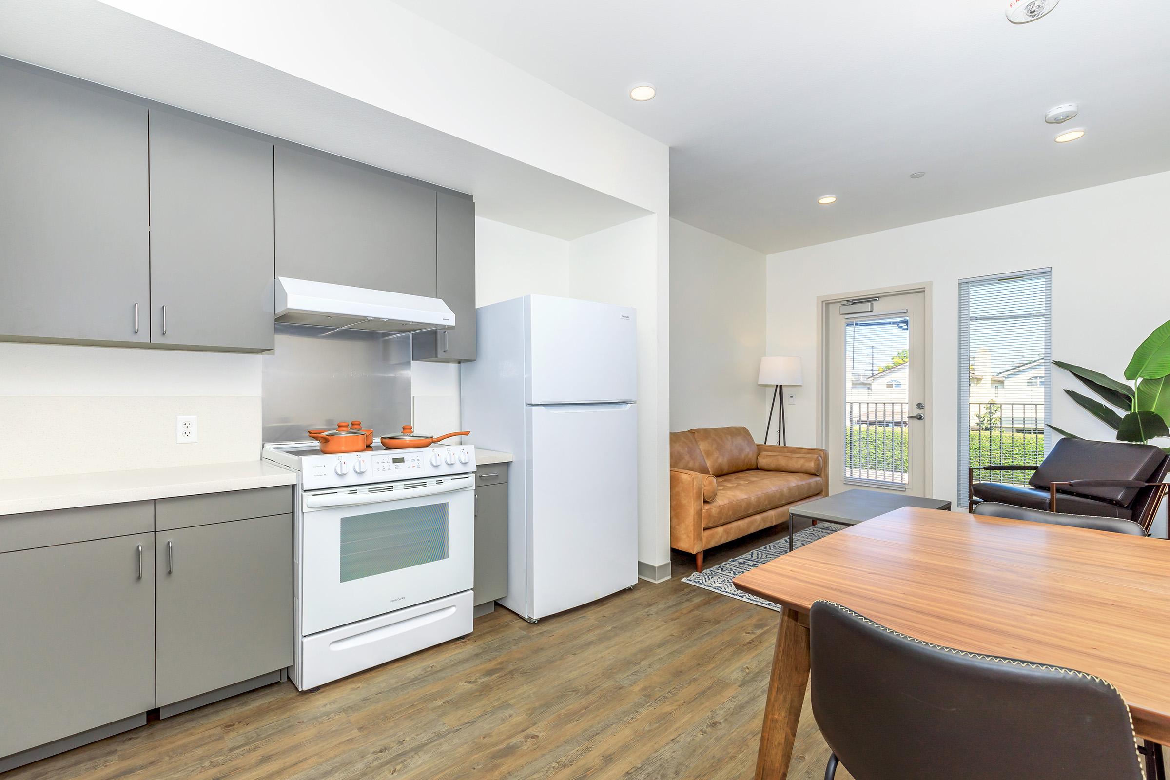 a kitchen with a table in a room