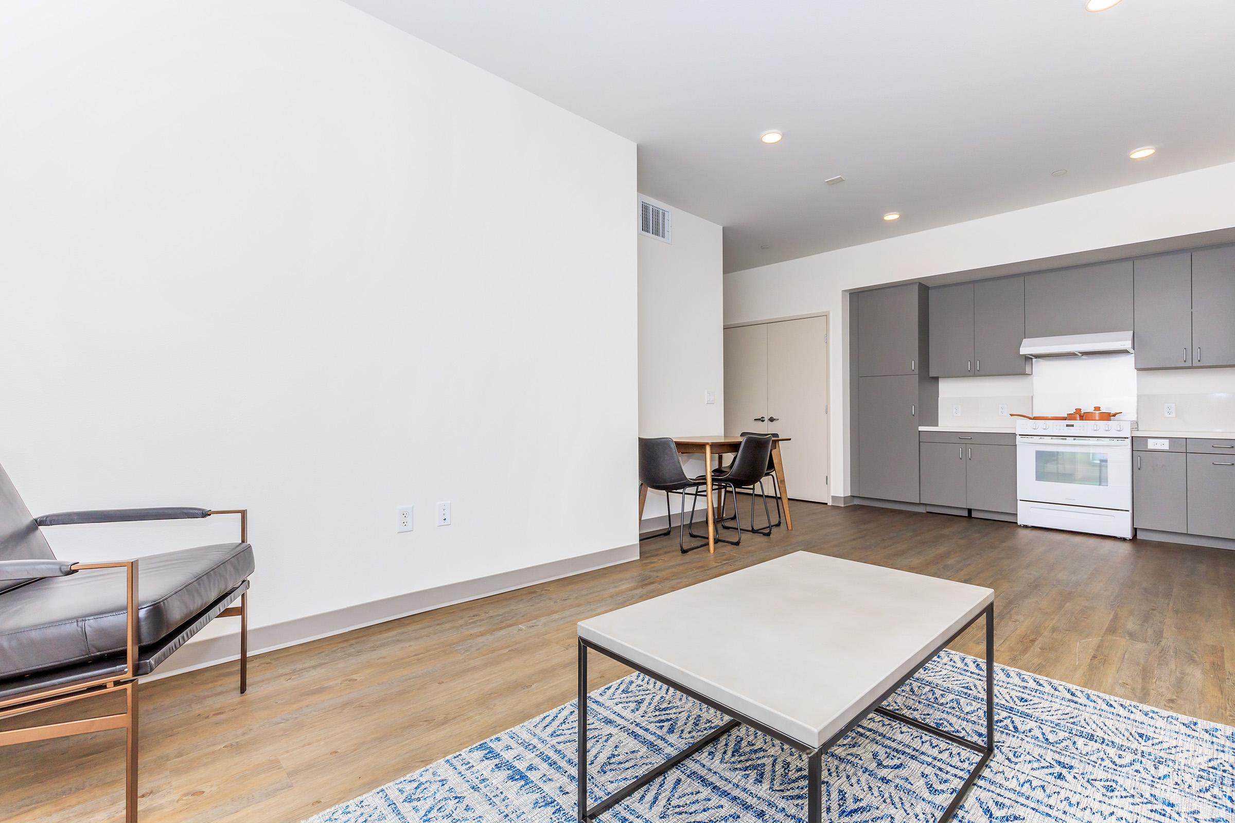 a kitchen with a table in a room