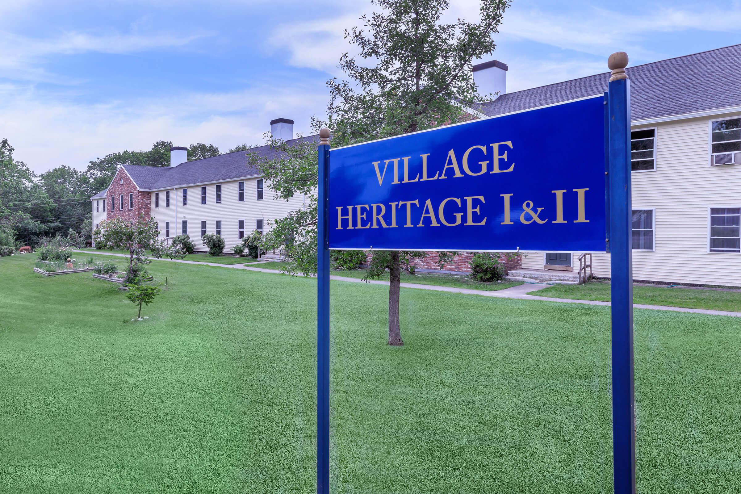 a blue sign in front of a house