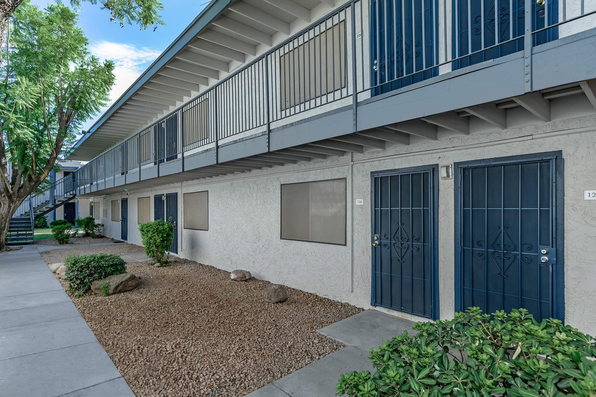 The pathway in front of the apartment doors at Rise at the Preserve.