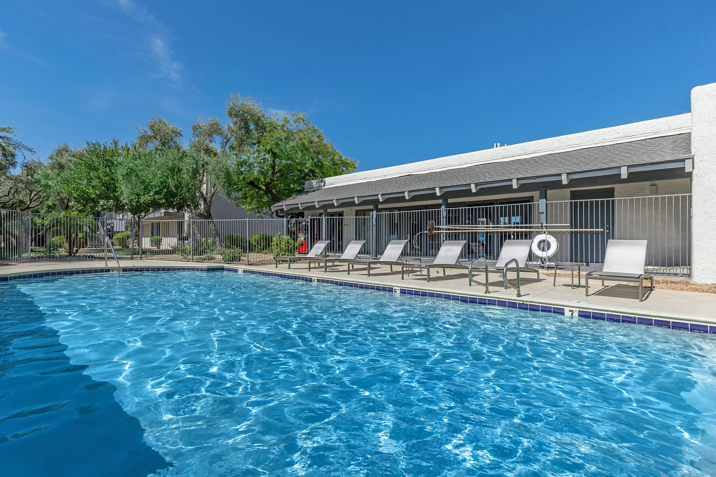 The pool at Rise at the Preserve with loungers.