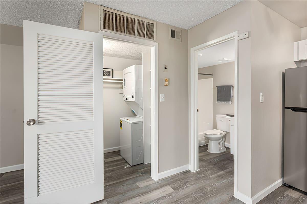 The washer and dryer room, bathroom, and kitchen at Rise at the Preserve.