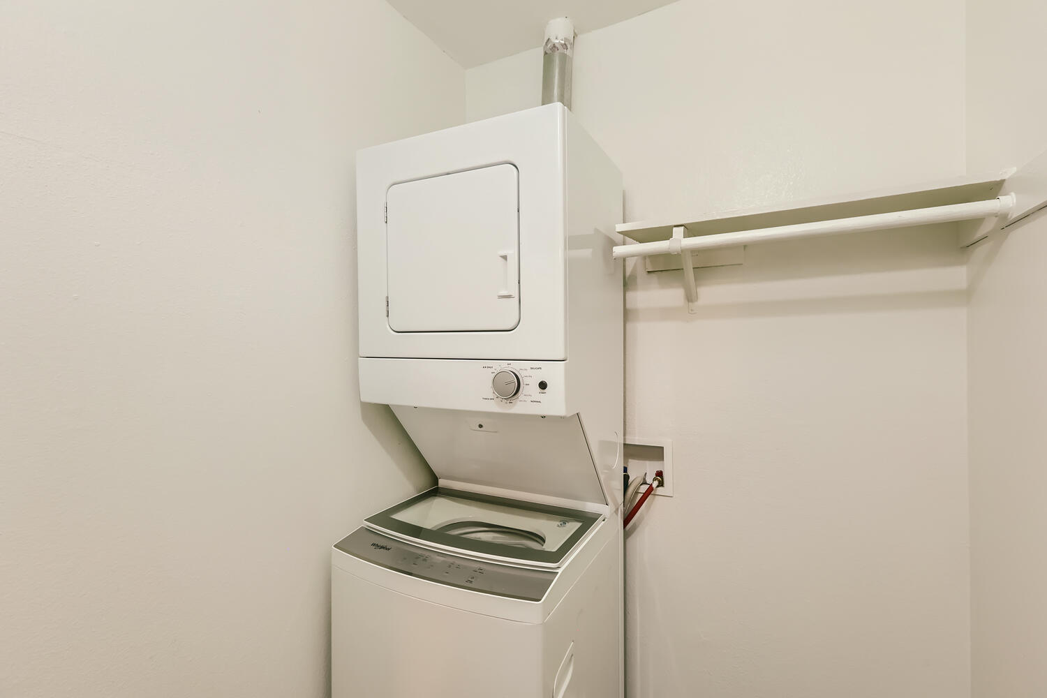 An apartment stacked washer and dryer at Rise at the Preserve. 