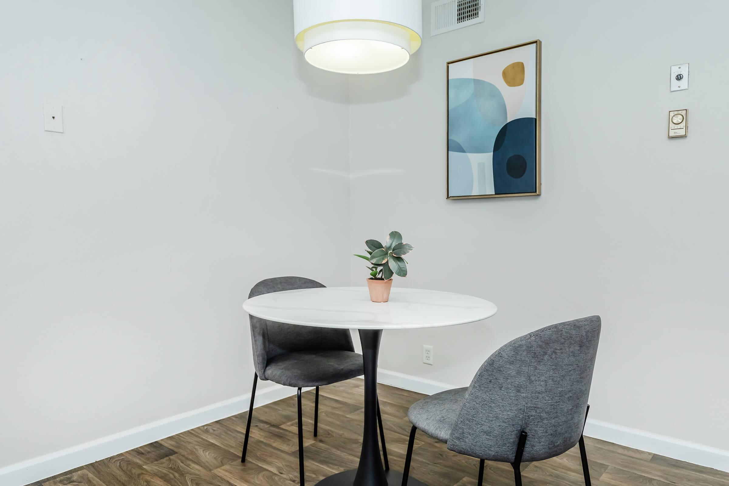 A small dining table in an apartment at Rise at The Preserve.