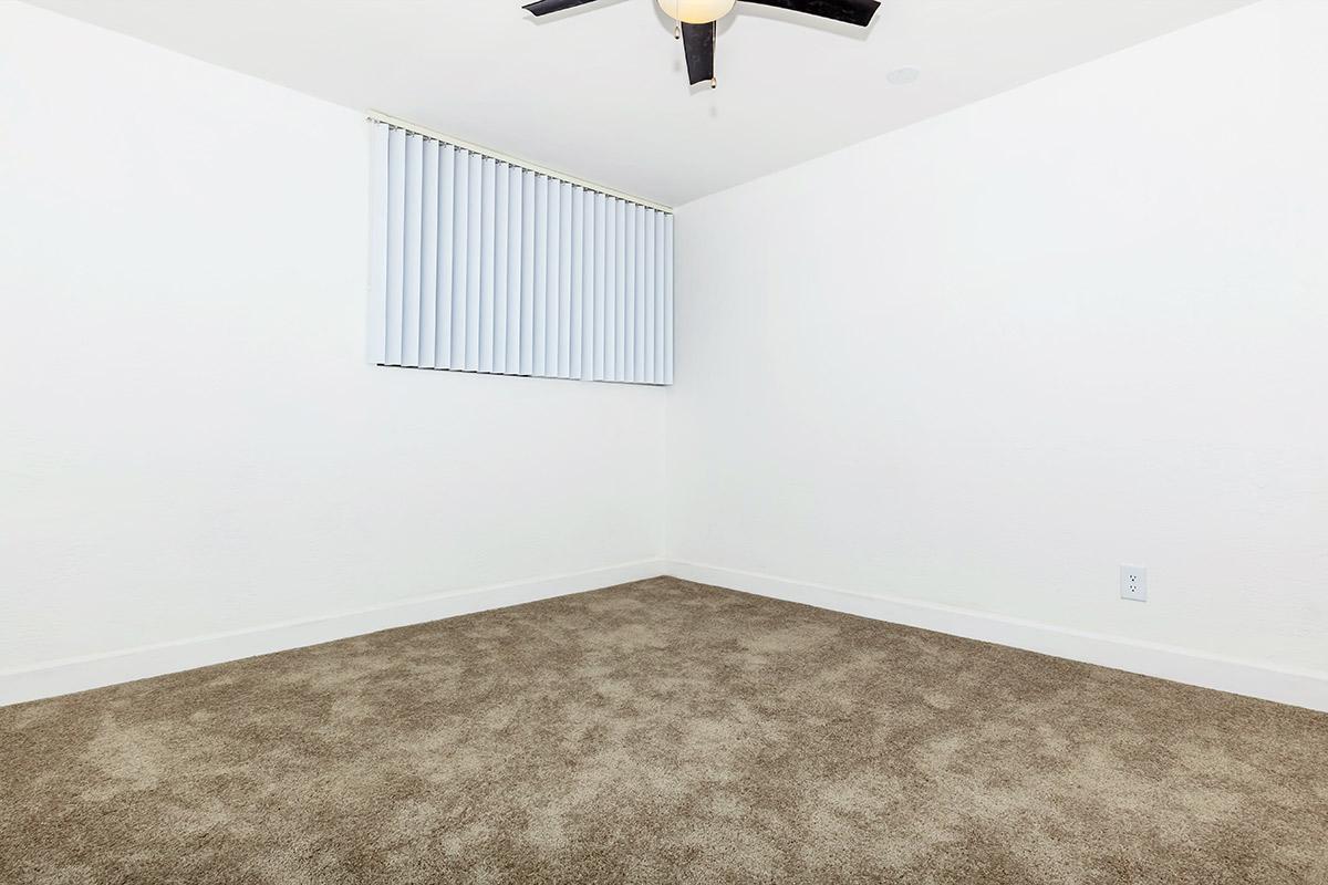 a bedroom with a bed in a room