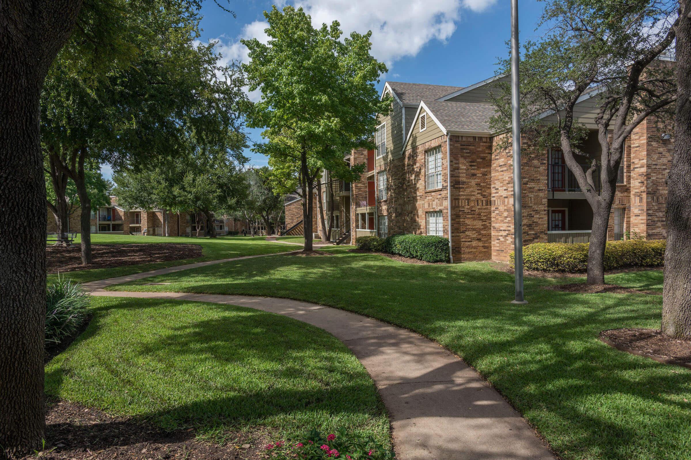 a community building with green grass