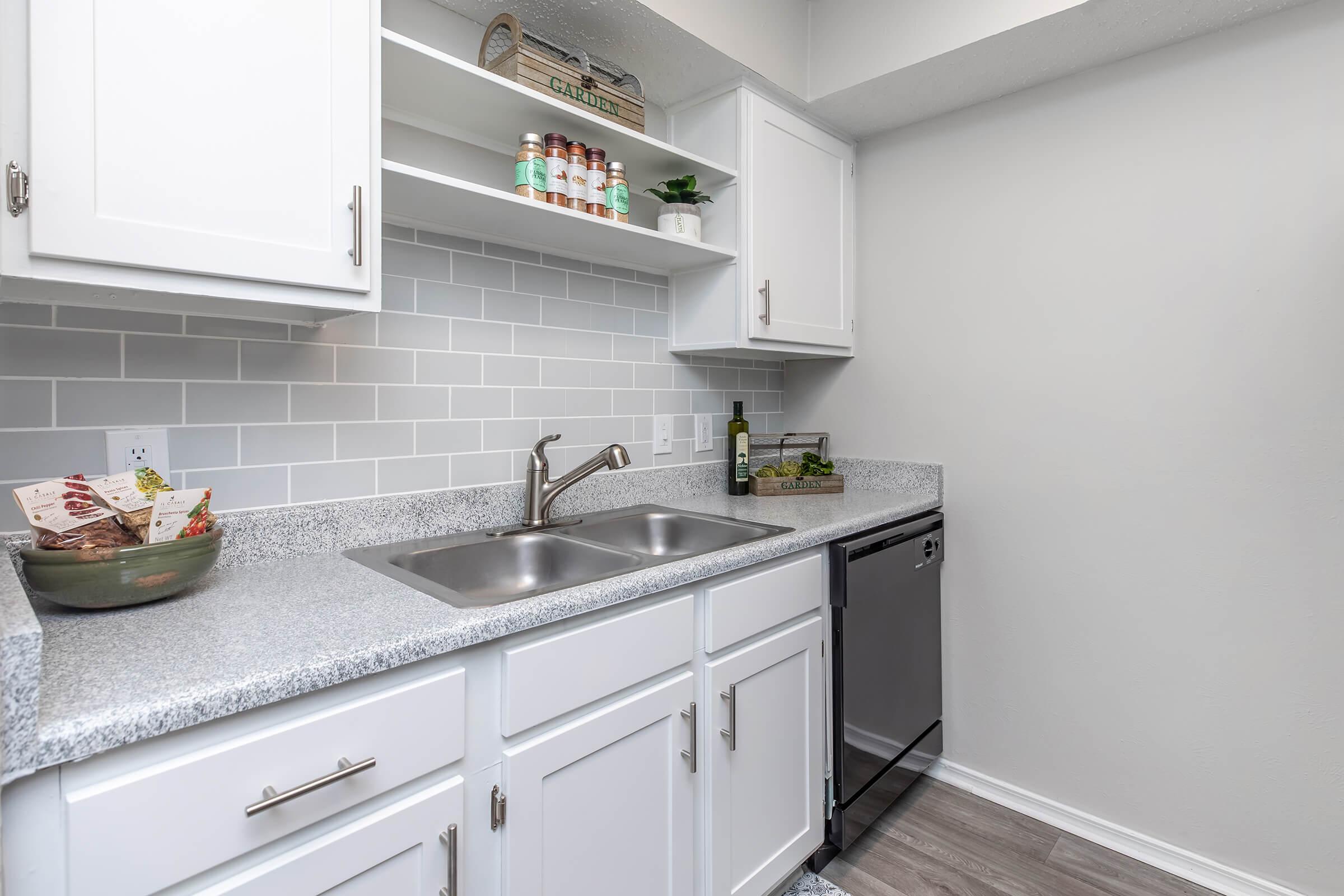 a kitchen with a sink and a microwave