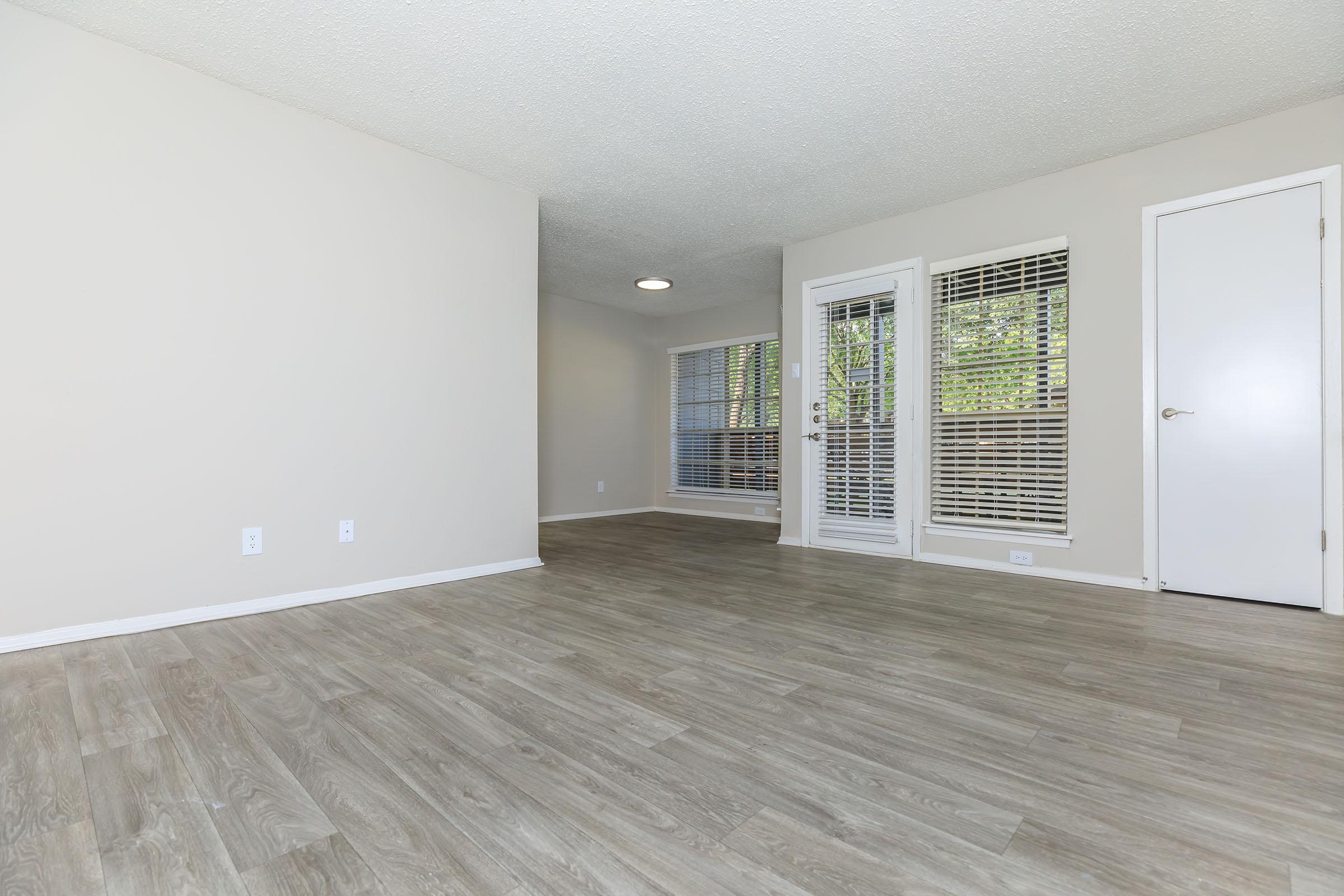 living room and dining room with wooden floors