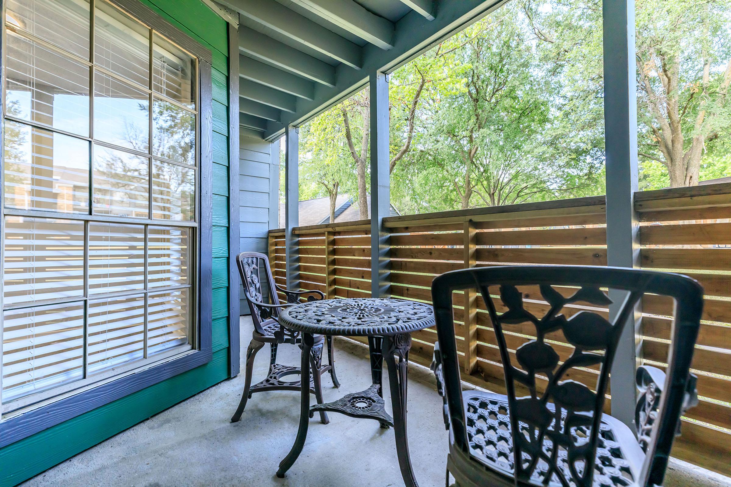 patio with a table and chairs