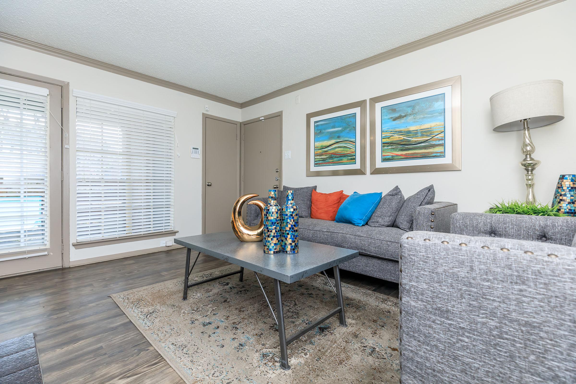 furnished living room with wooden floors