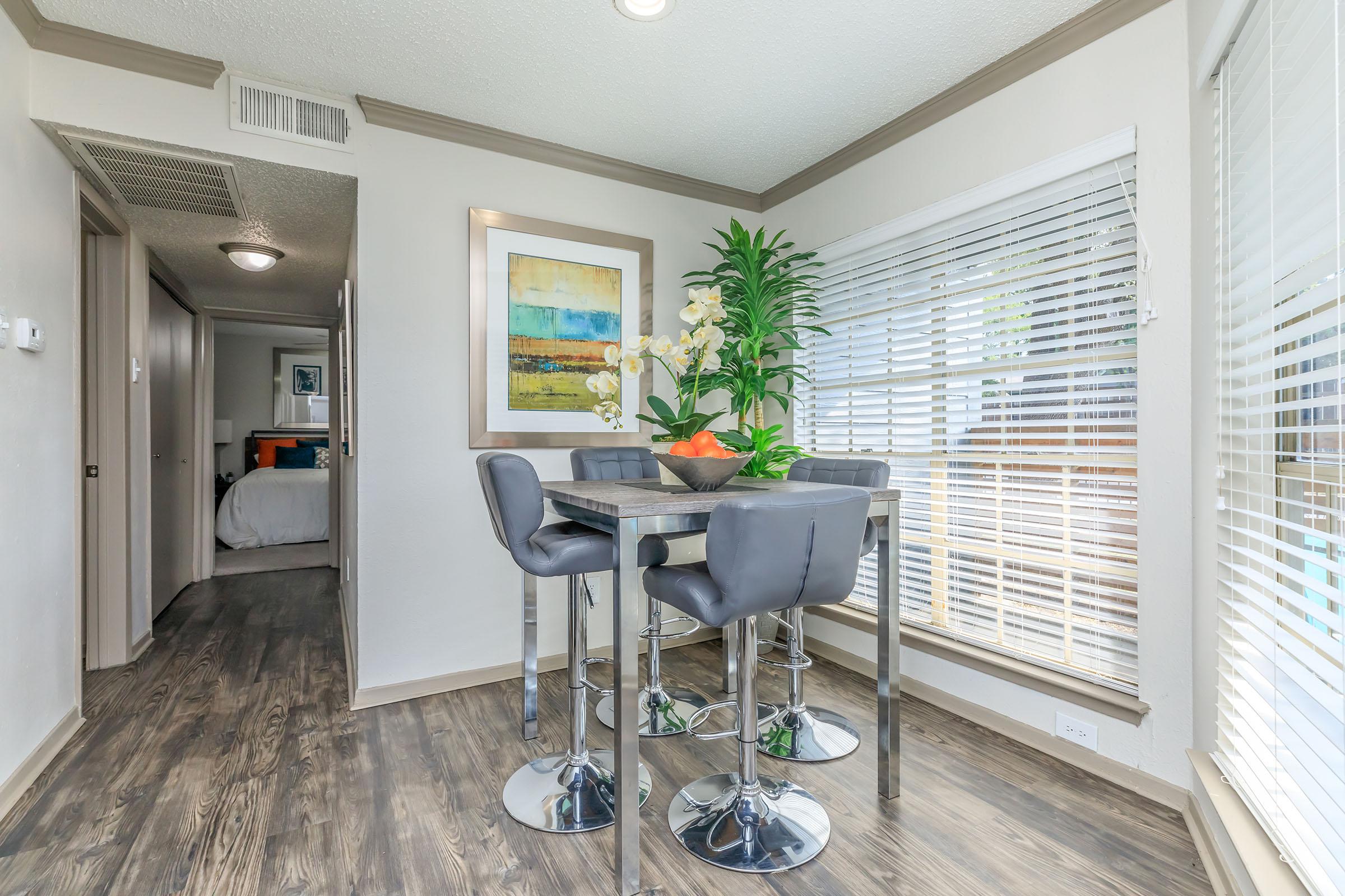 furnished dining room with grey chairs