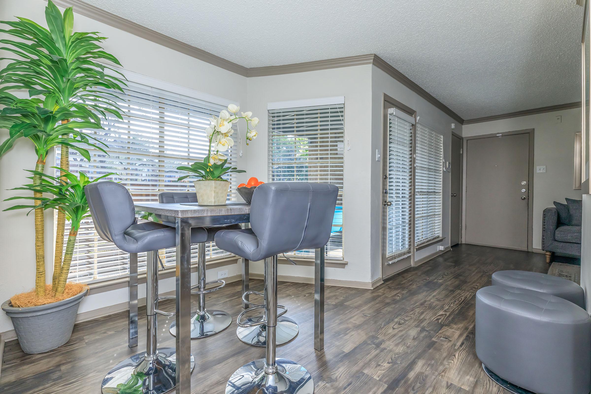 furnished dining room with wooden floors