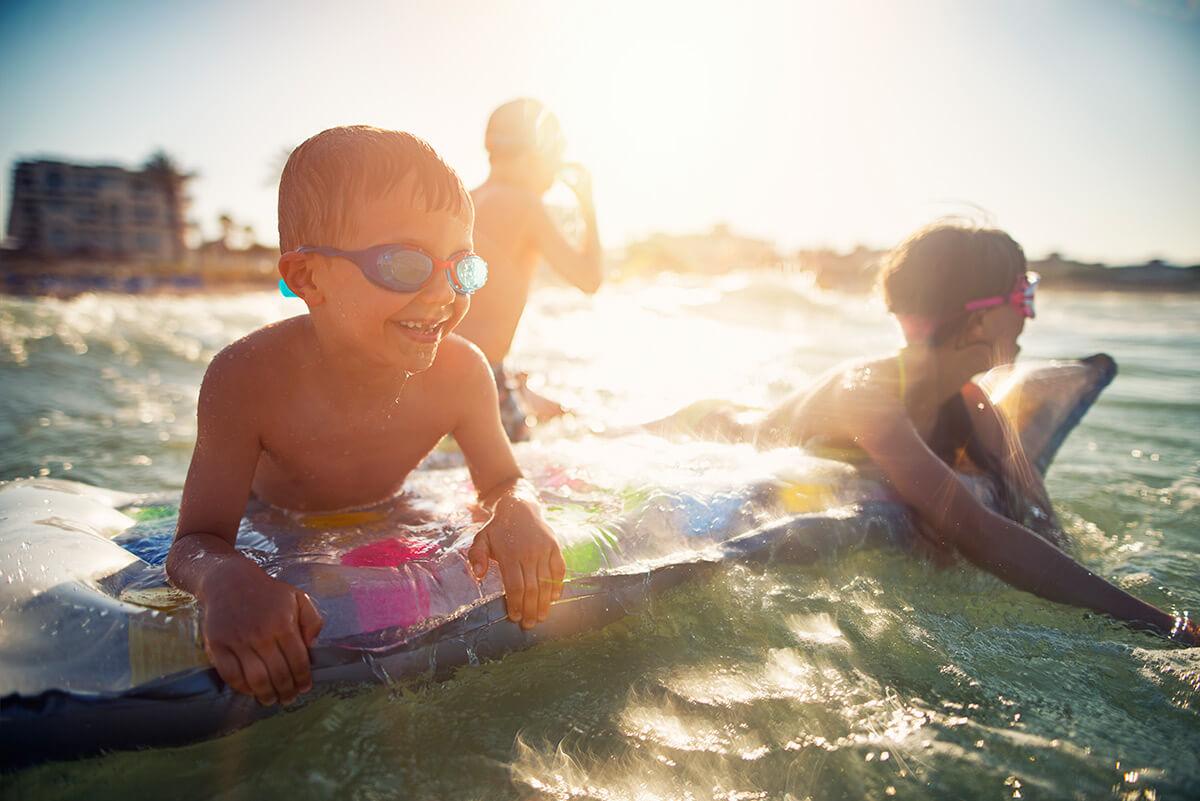 Kids swimming in the ocean