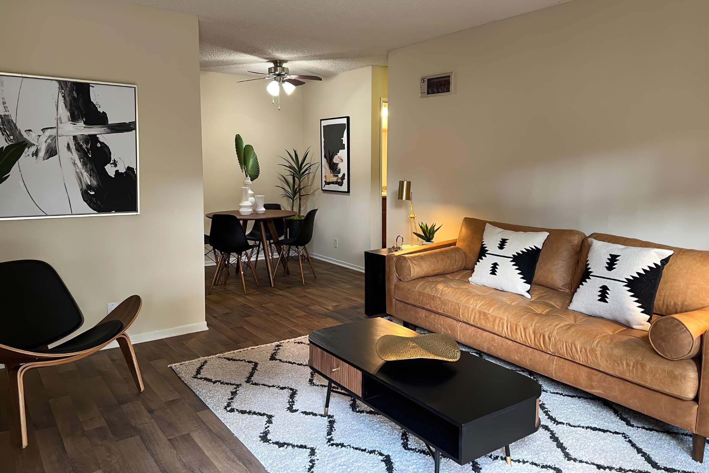 a living room with an orange couch