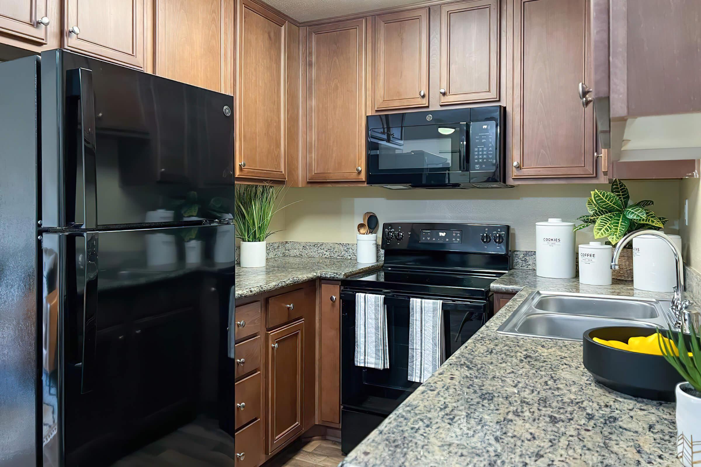 a kitchen with granite countertops