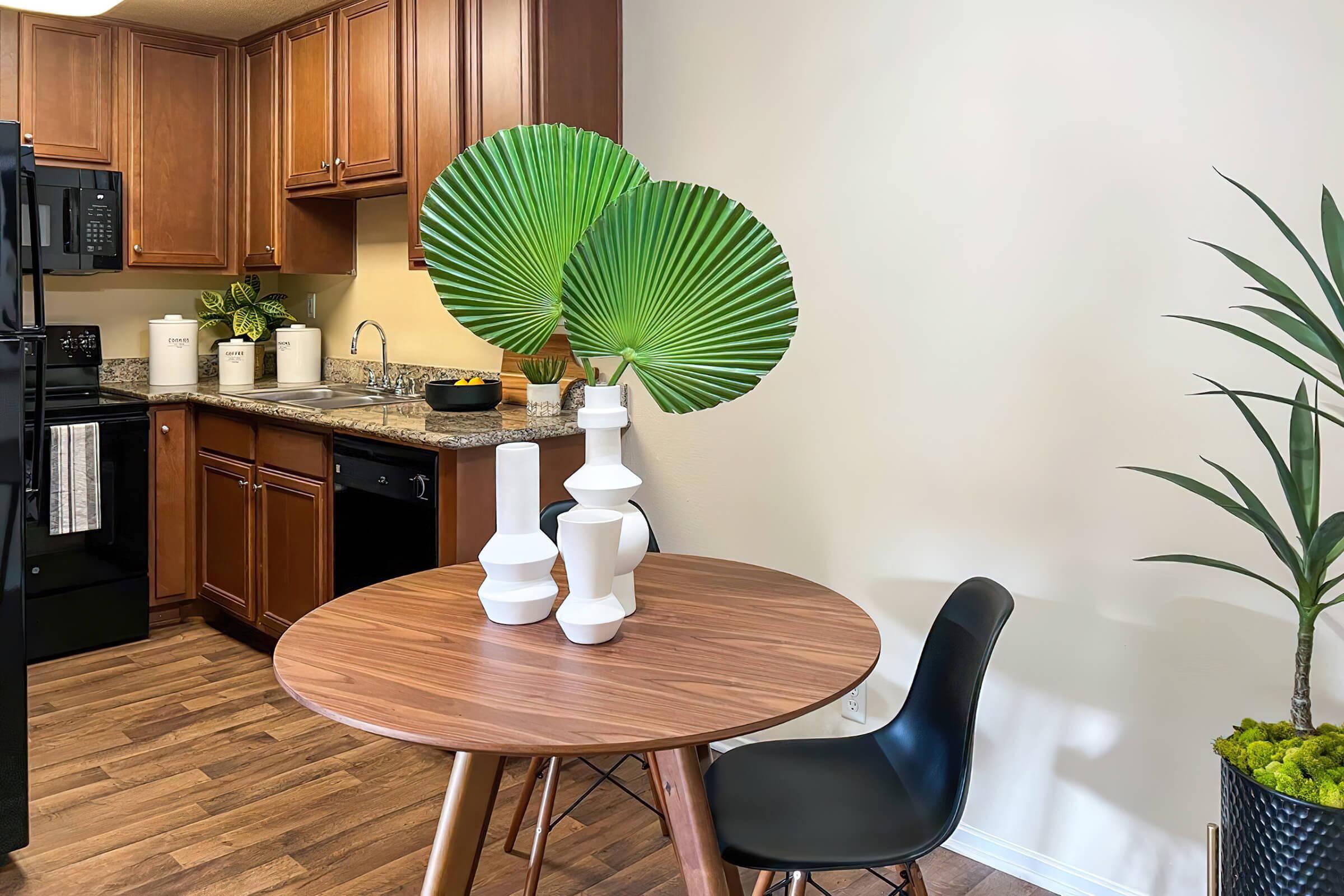 a dining room with plants