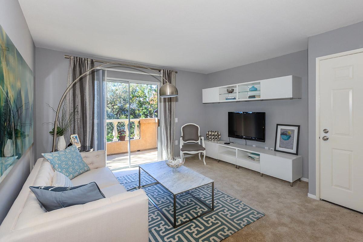 living room with sliding glass doors to the patio