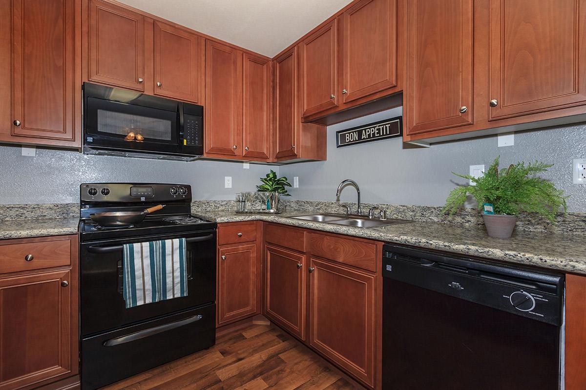 a kitchen with black appliances