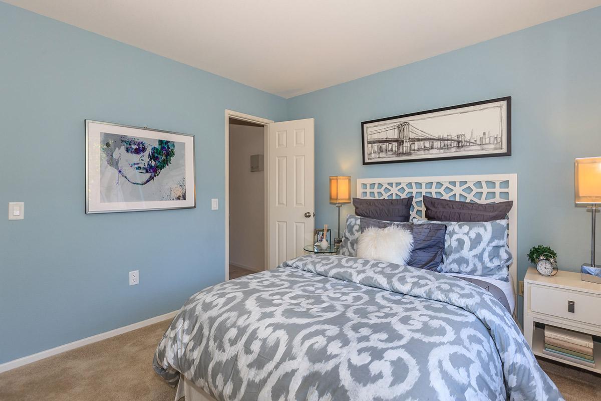 a bedroom with blue walls