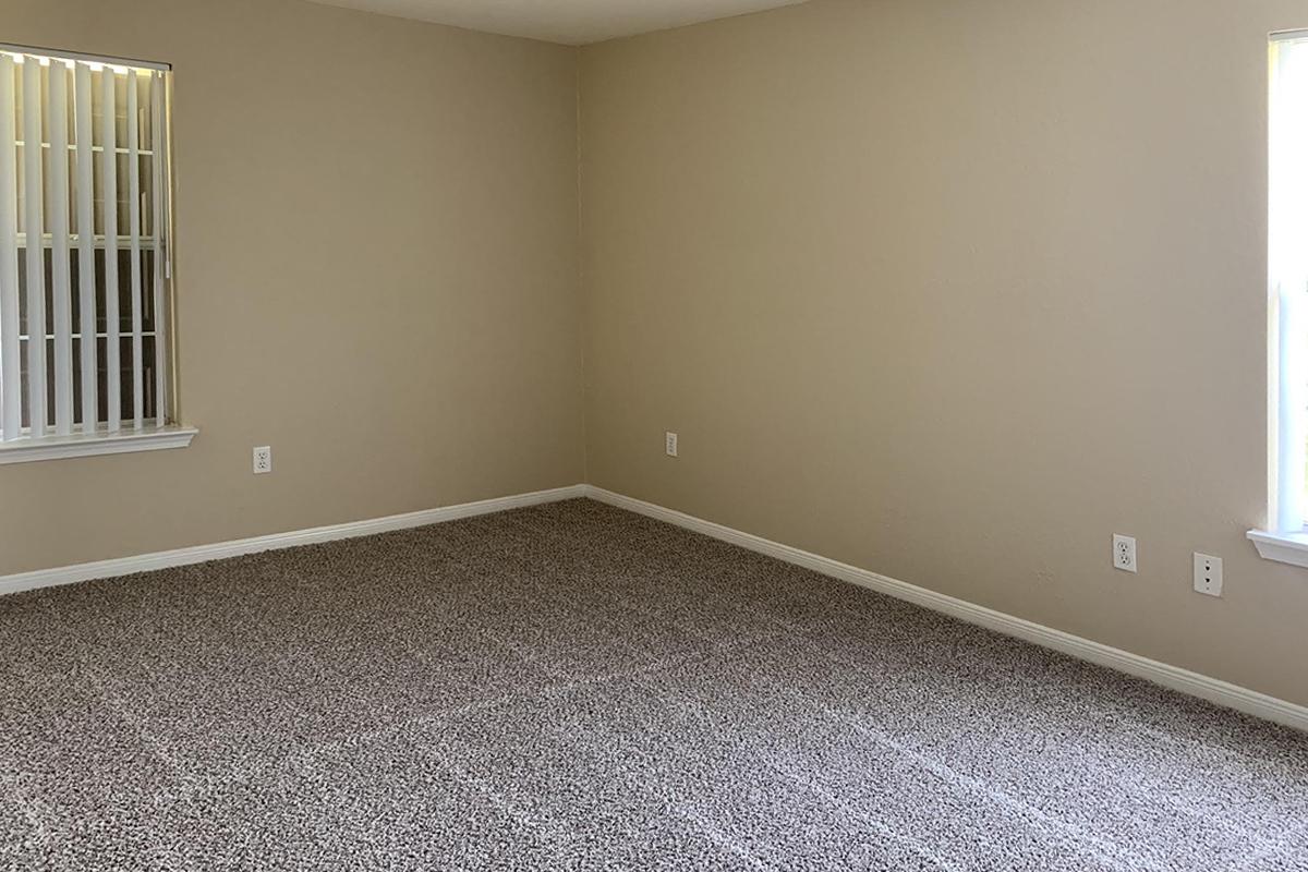 a bedroom with a large window