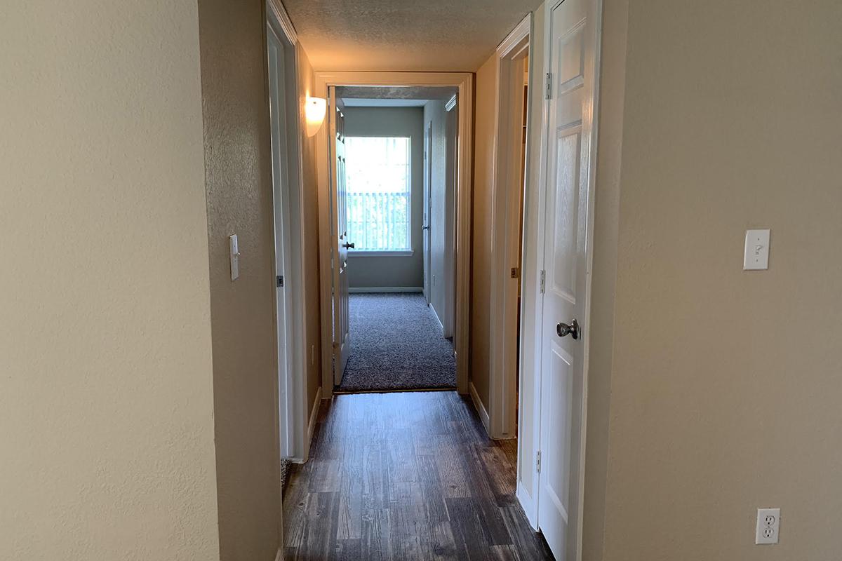 a view of a tiled floor next to a door