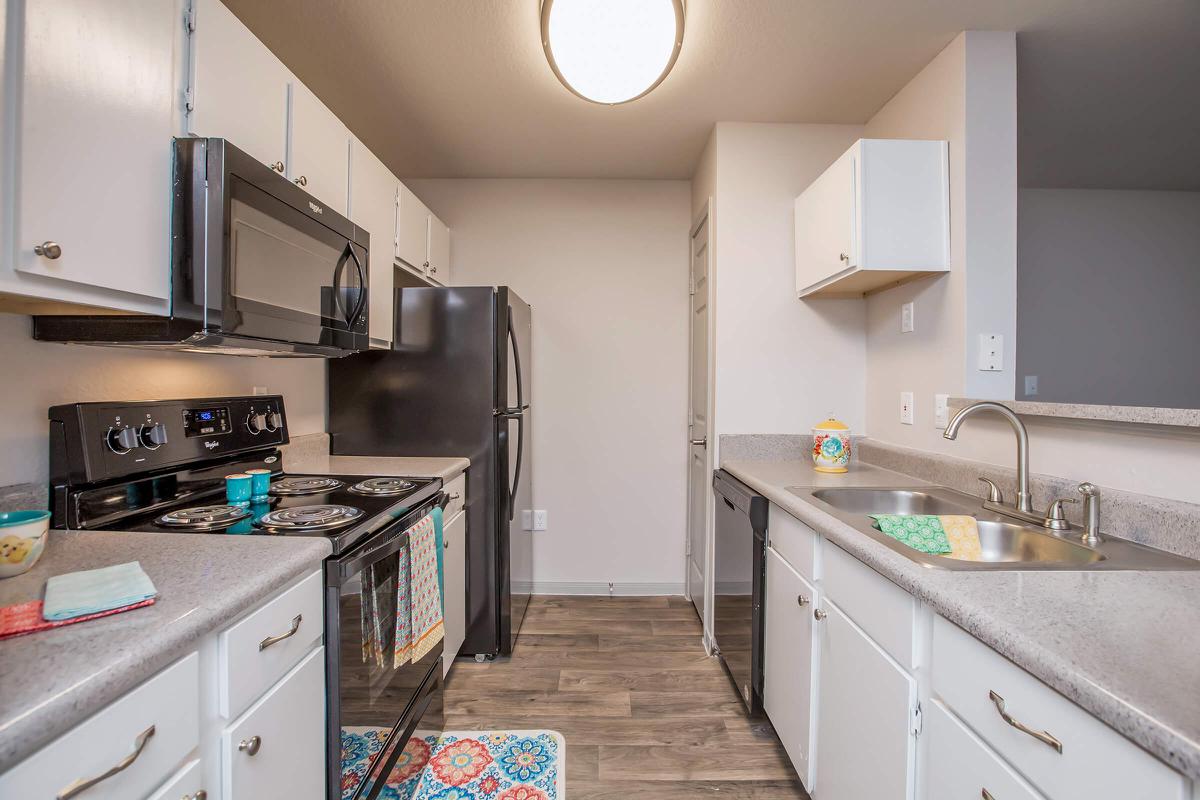 a kitchen with a stove and a sink