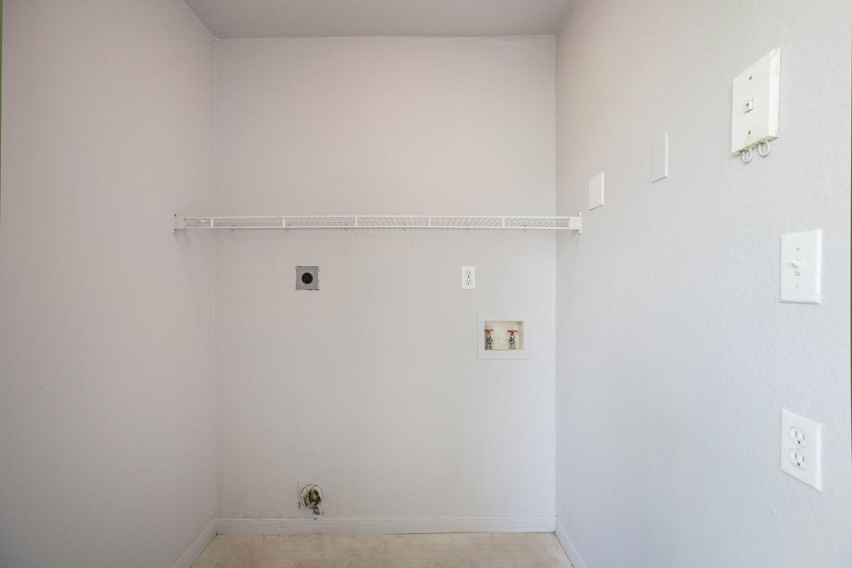 a white sink in a small room