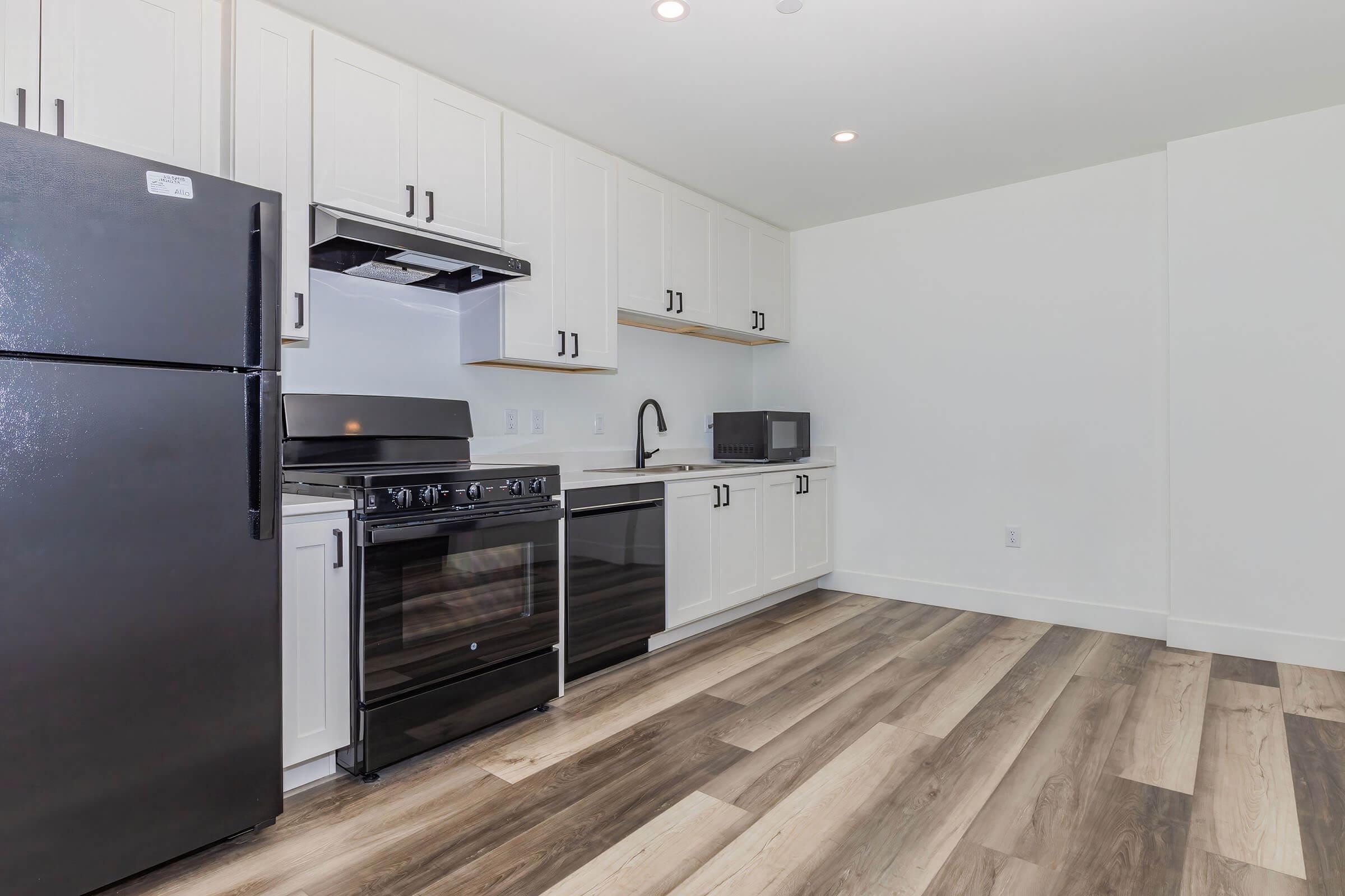 a large kitchen with stainless steel appliances