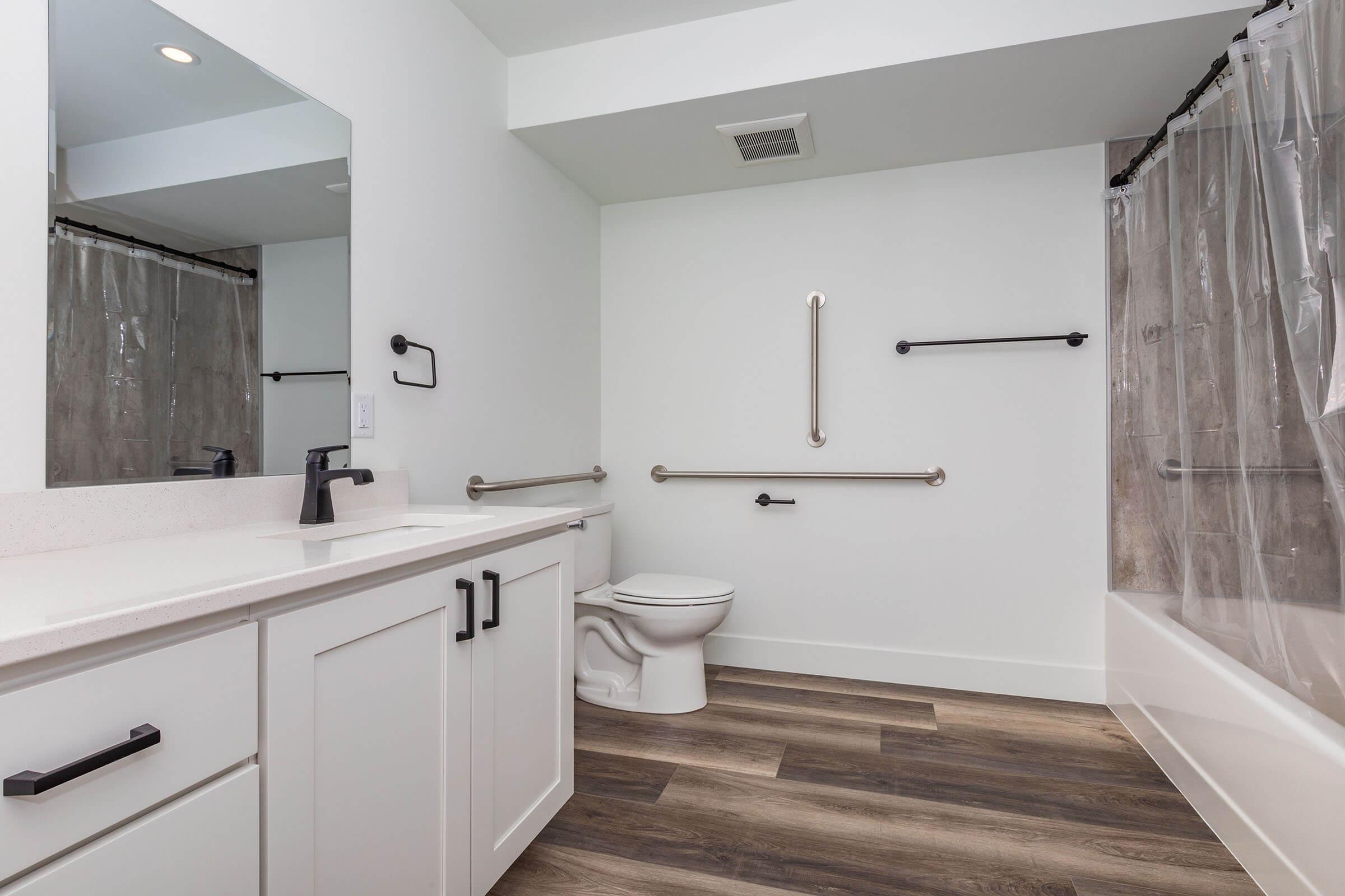 a kitchen with a sink and a mirror