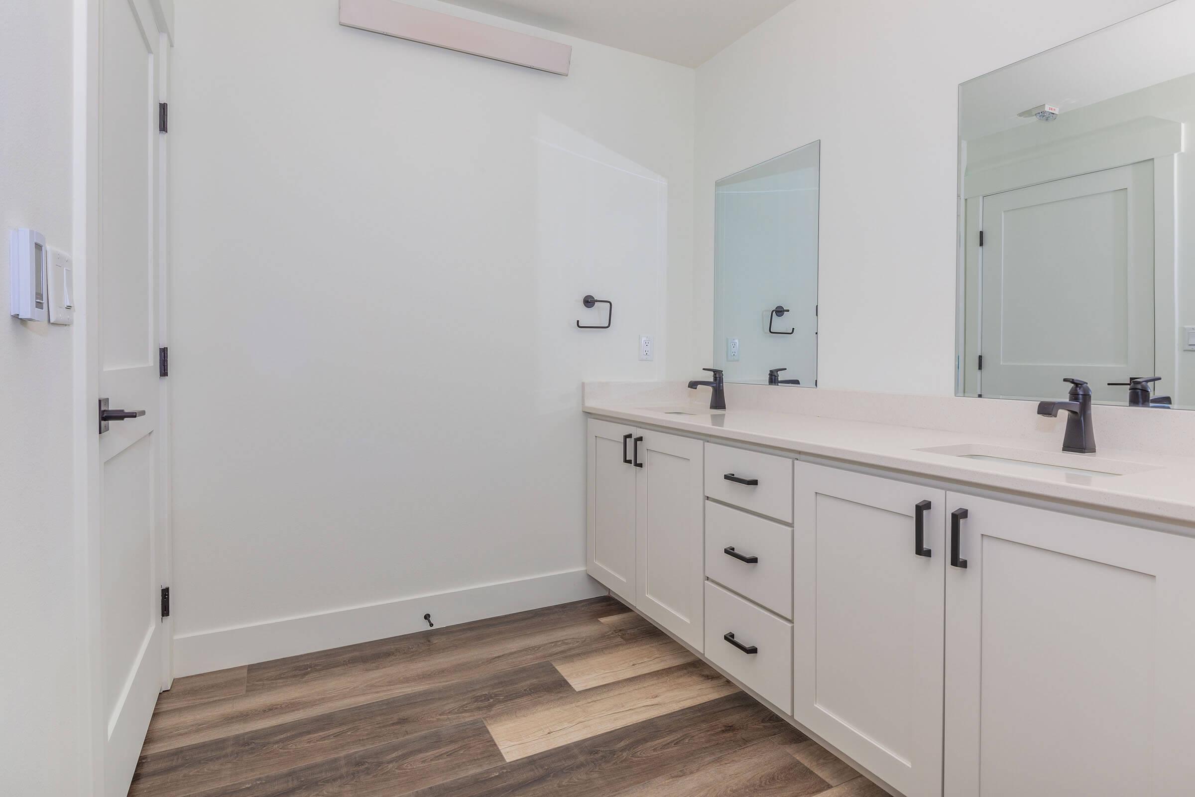 a kitchen with a sink and a refrigerator