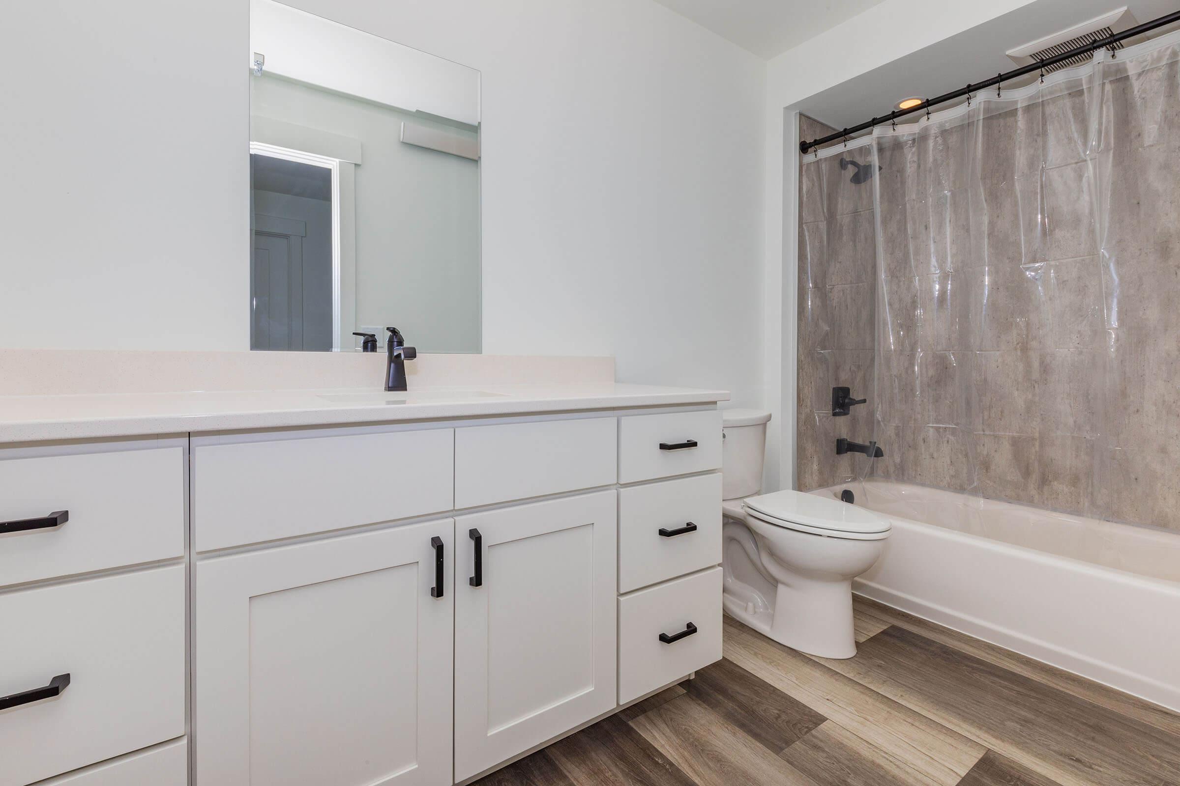 a kitchen with a sink and a mirror