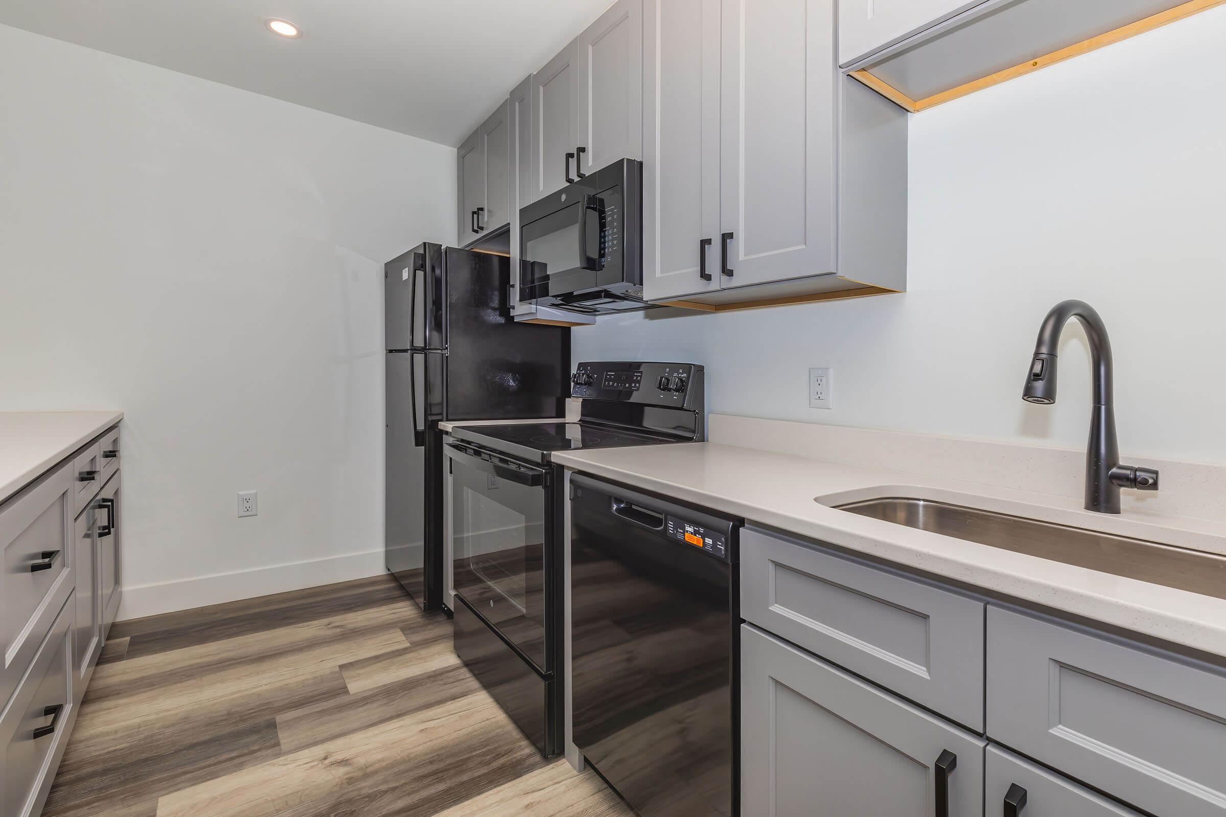 a kitchen with a stove and a sink