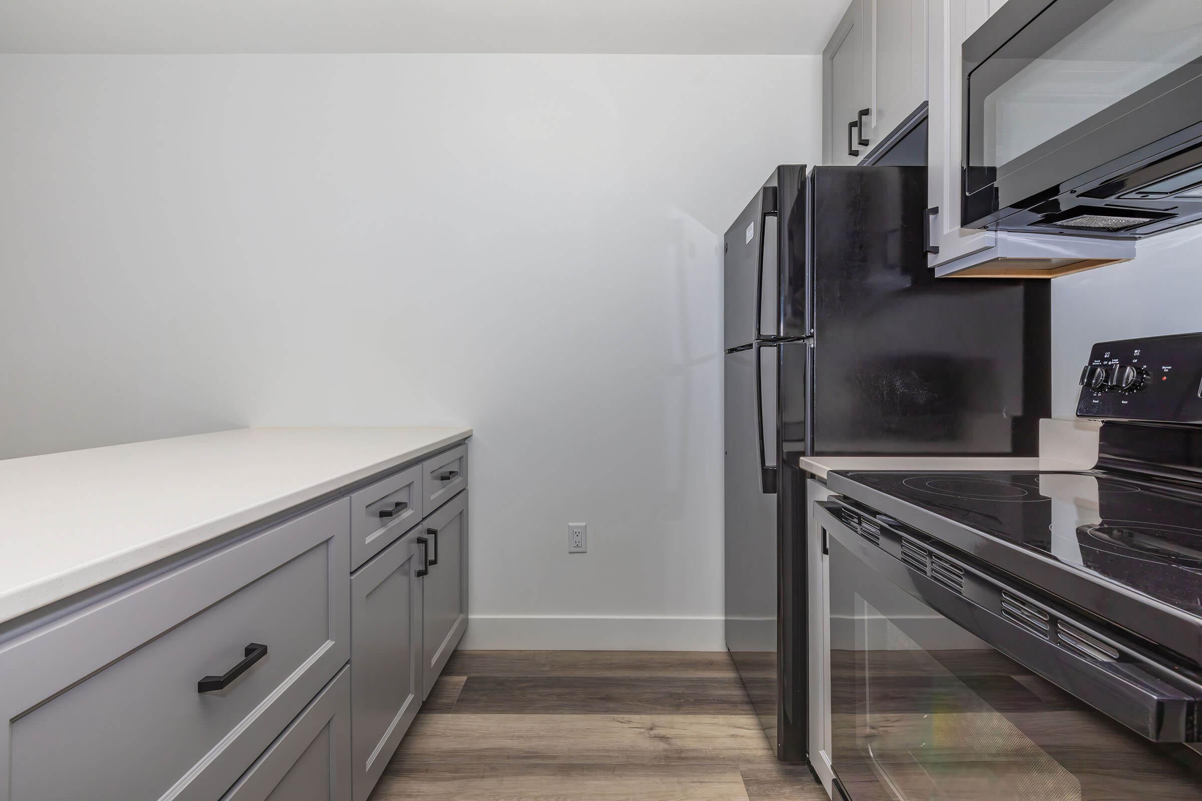 a stove top oven sitting inside of a kitchen