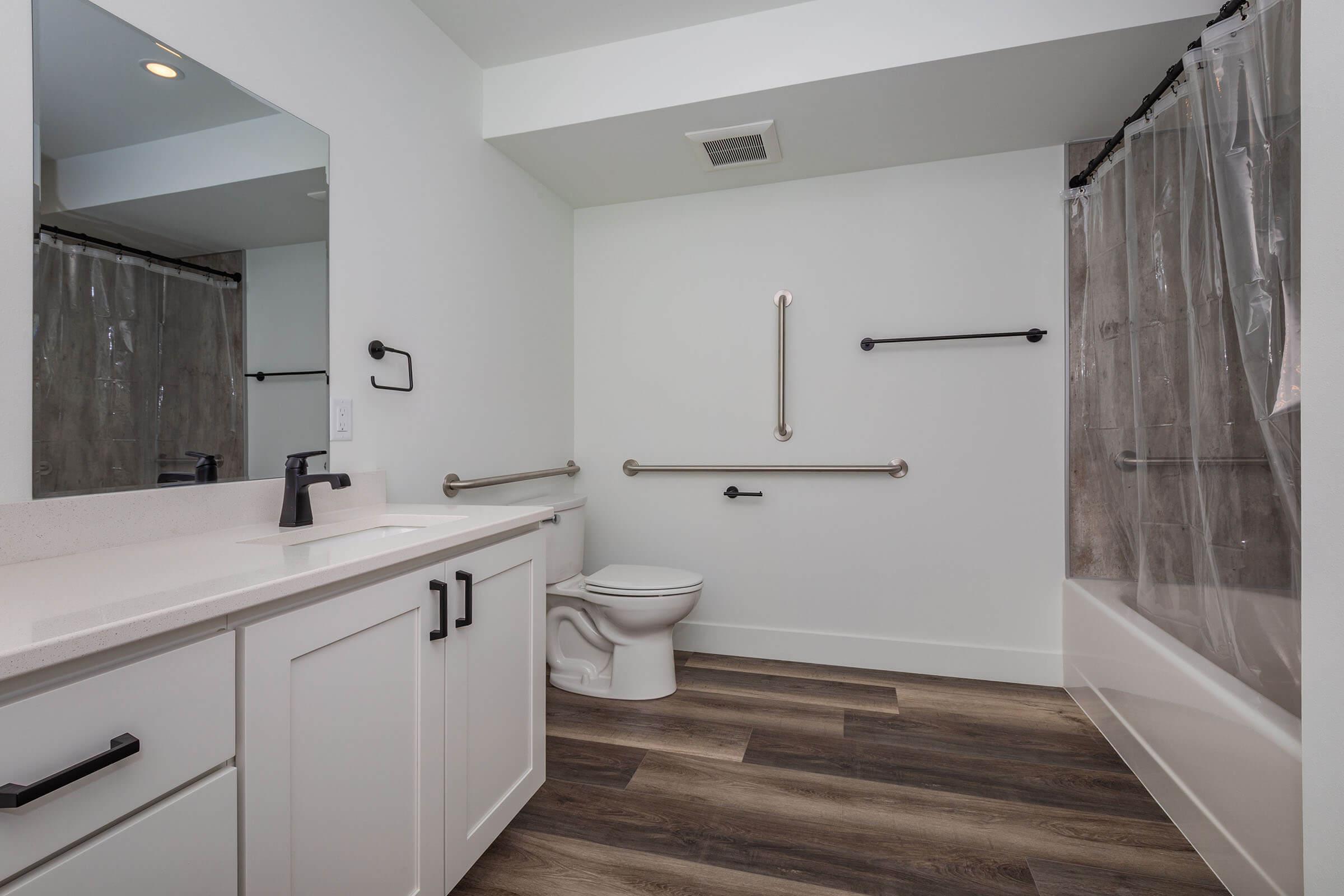 a kitchen with a sink and a mirror