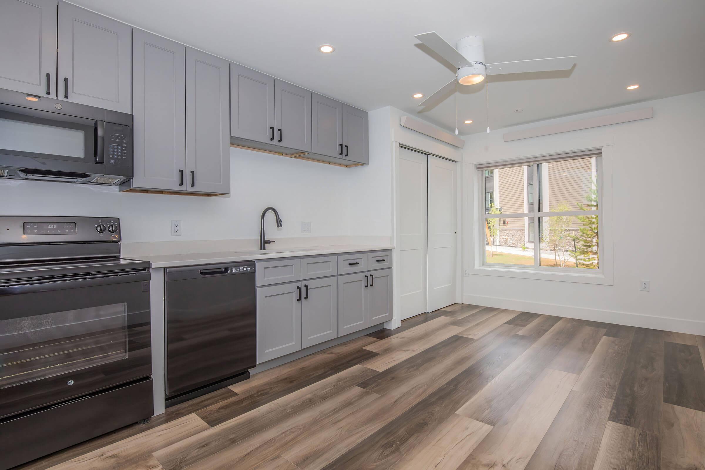 a kitchen with a large window