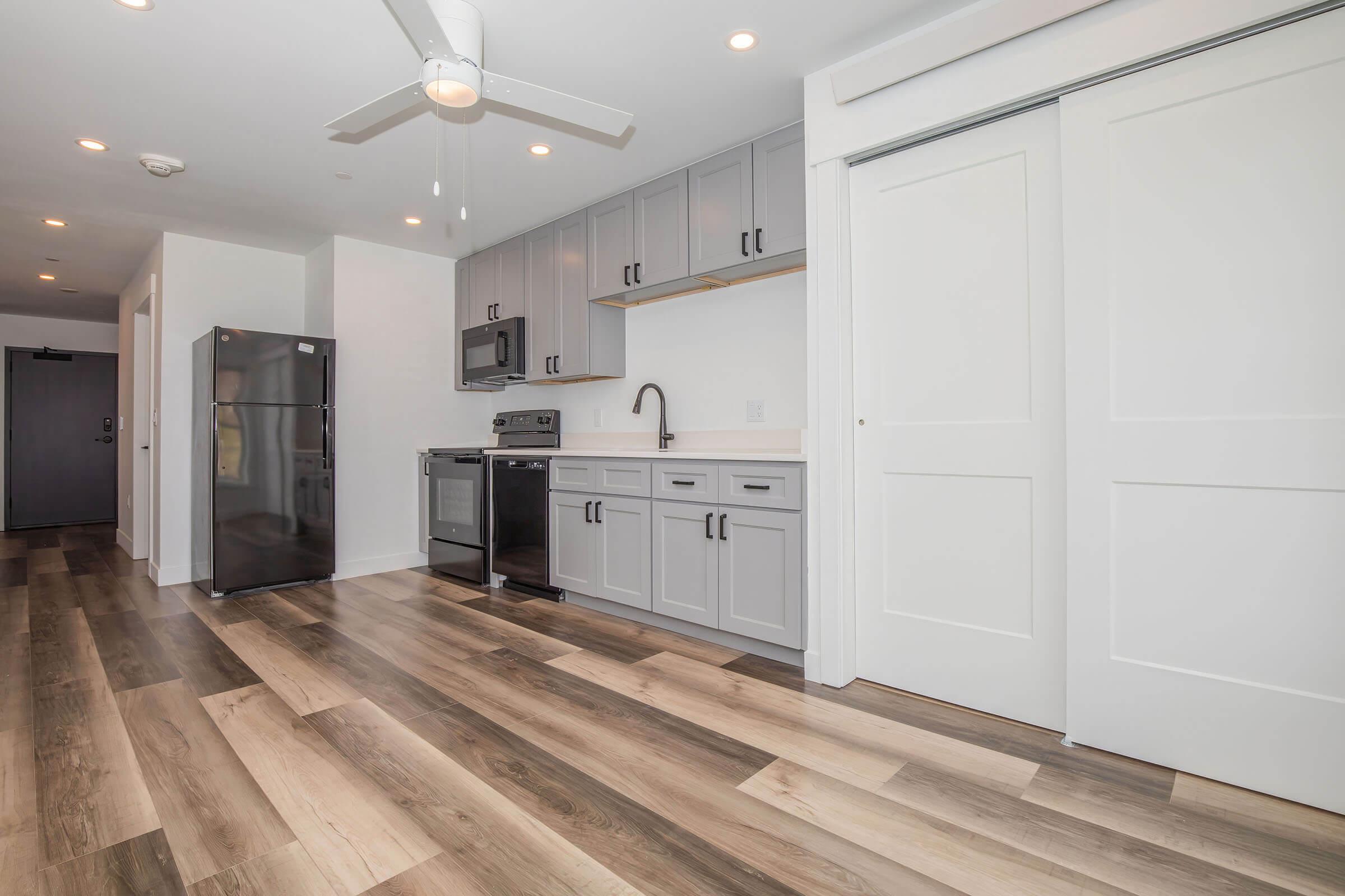 a kitchen with a building in the background