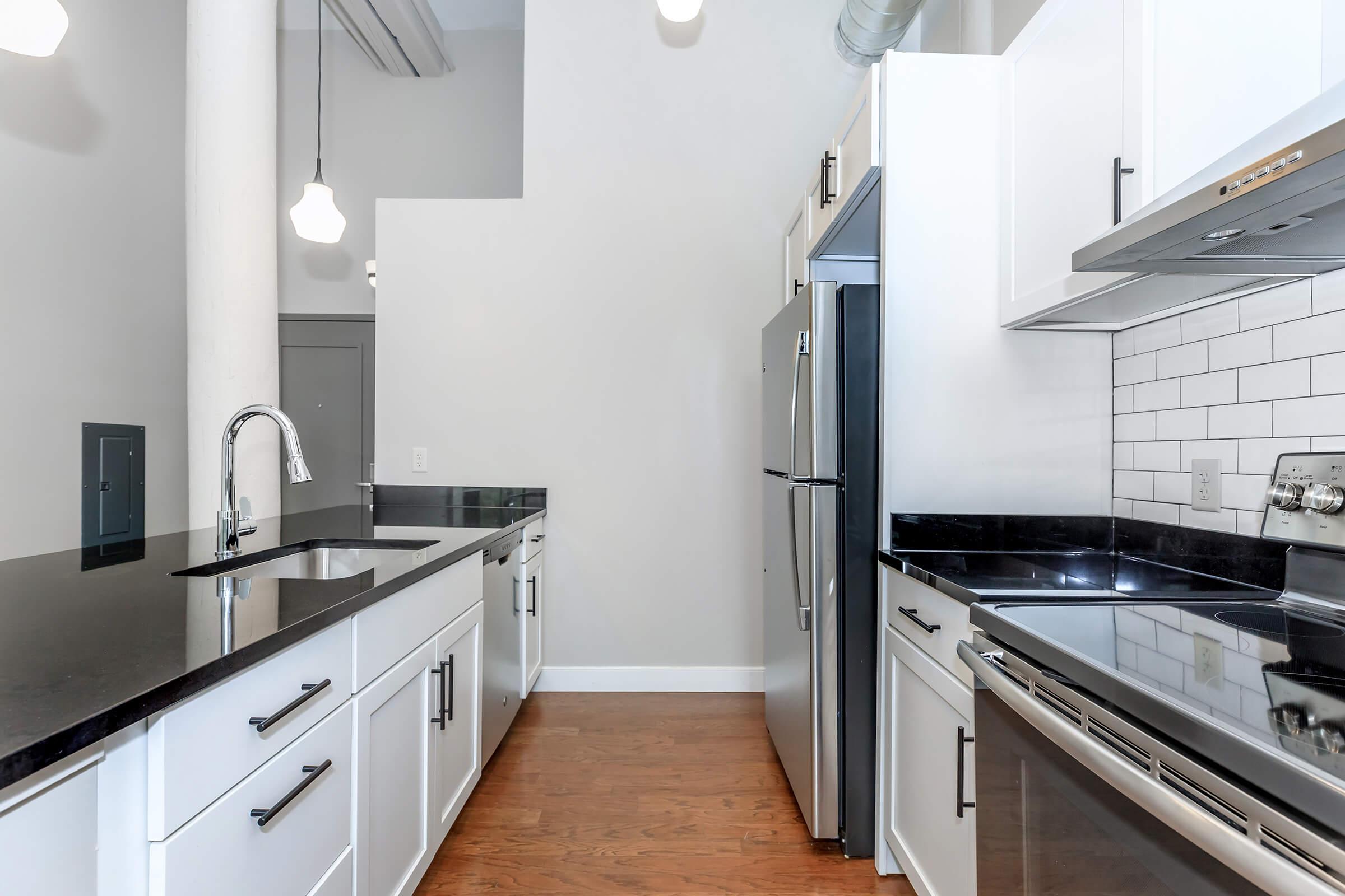 a large kitchen with stainless steel appliances