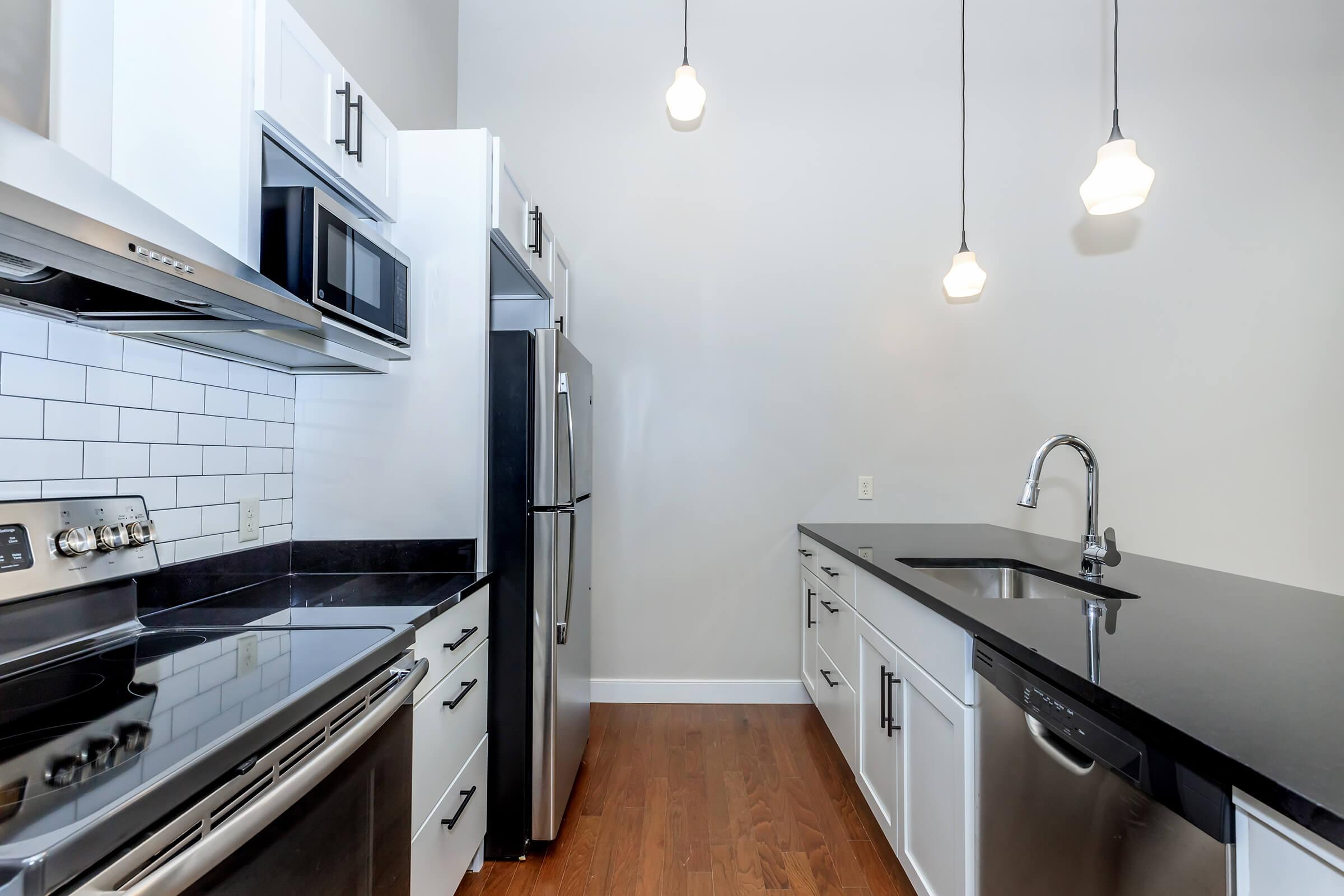 a kitchen with a stove and a sink