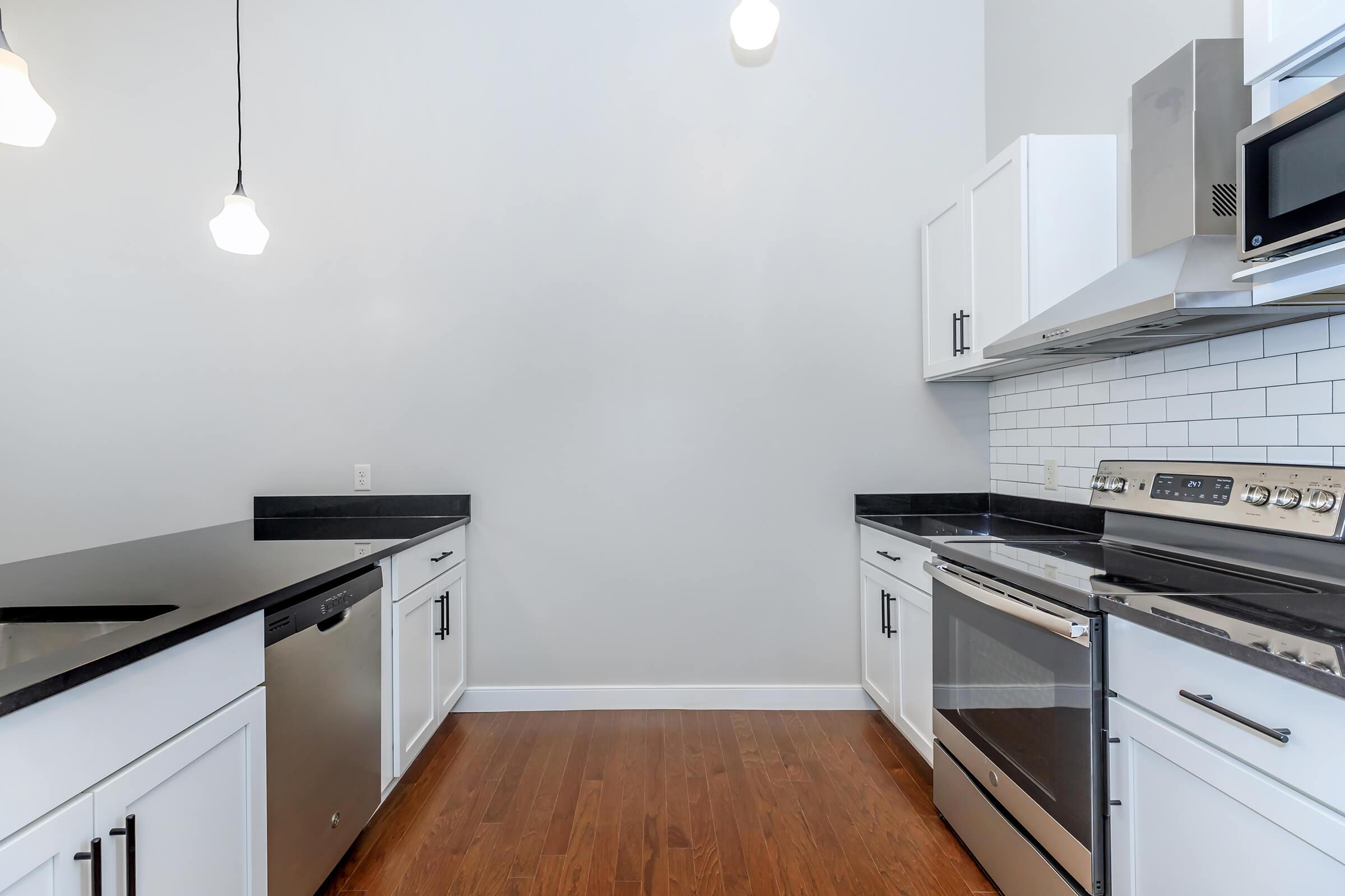 a kitchen with a stove and a microwave