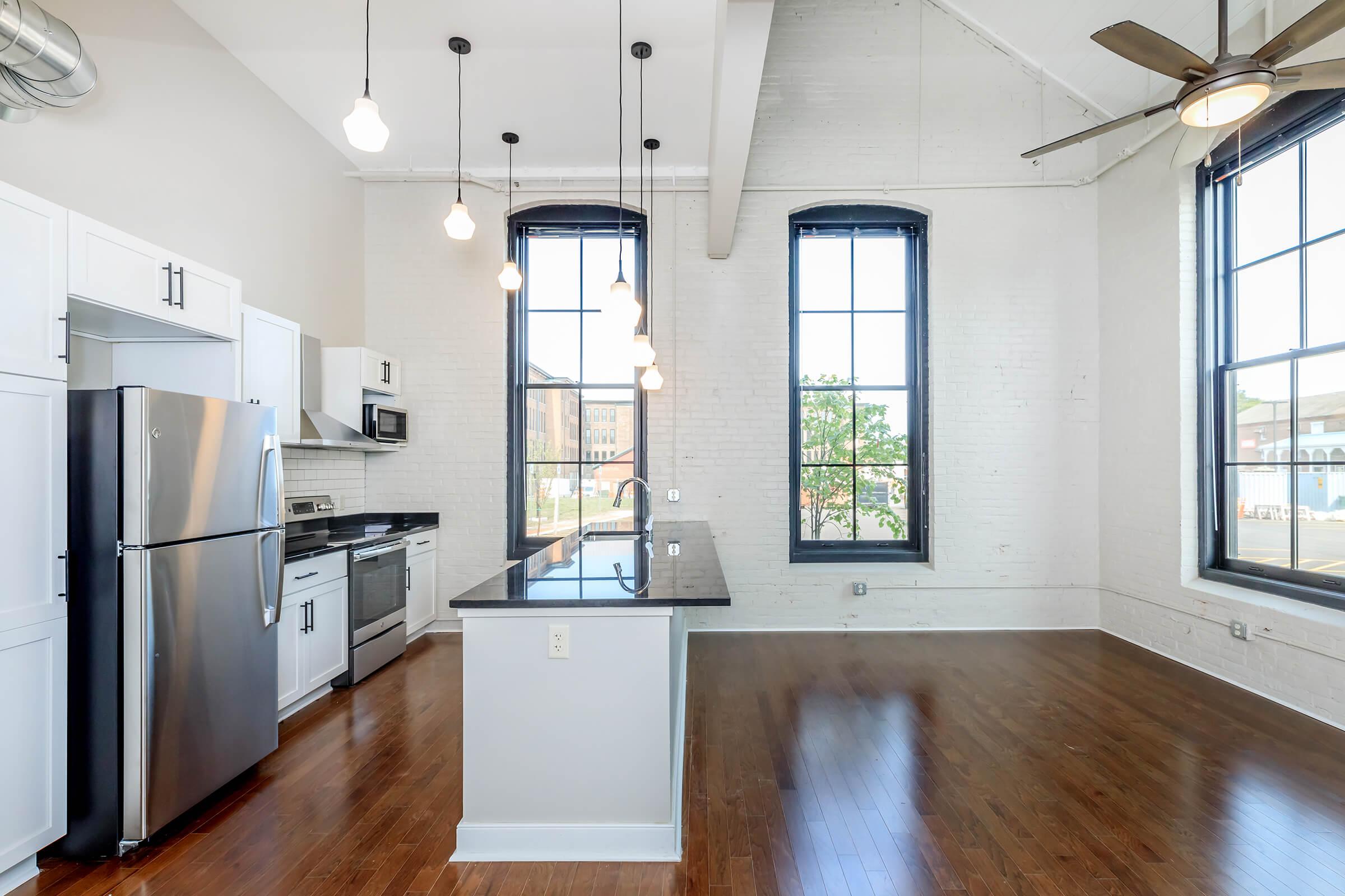 a kitchen with a sink and a window