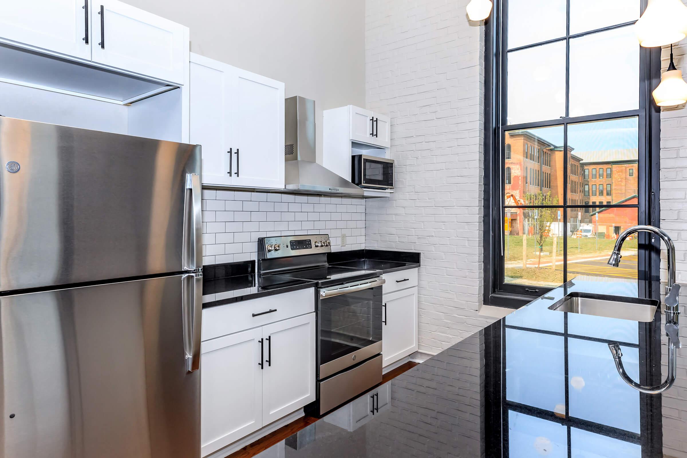 a kitchen with a stove and a refrigerator