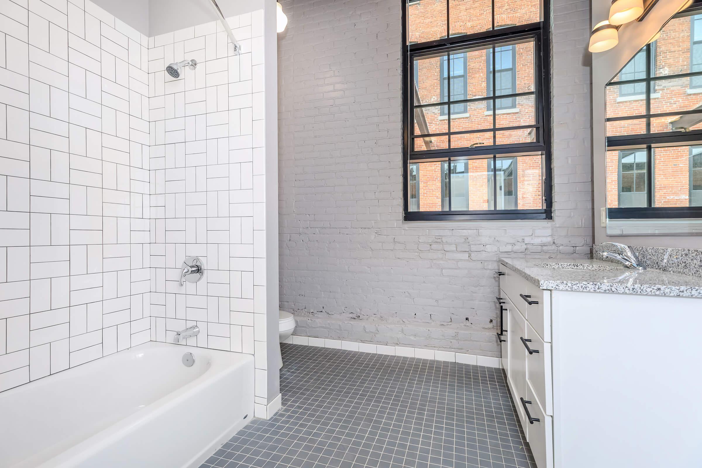 a sink sitting under a window