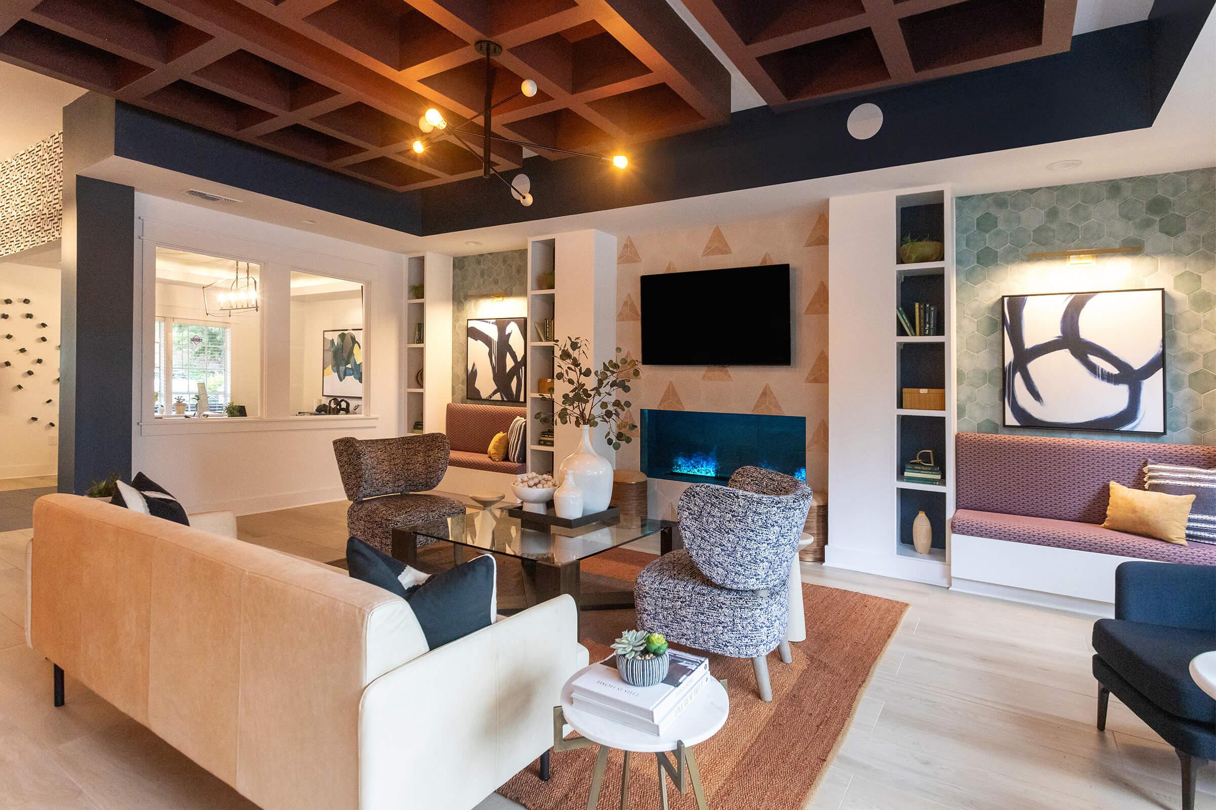 a living room filled with furniture and a large window