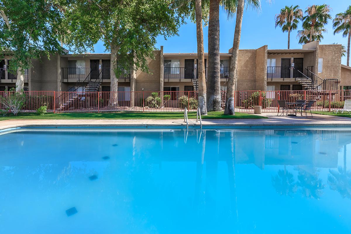 a large pool of water in front of a house