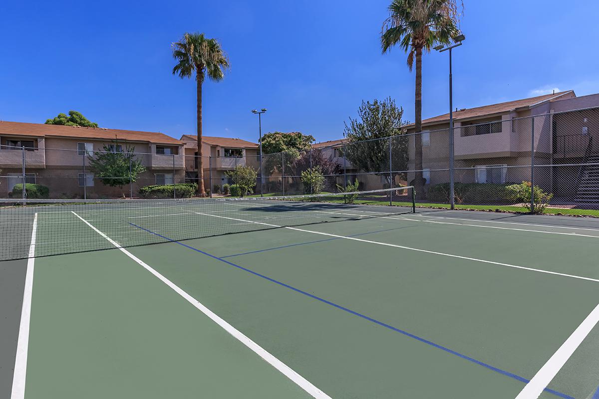 a basketball on a court with a racket