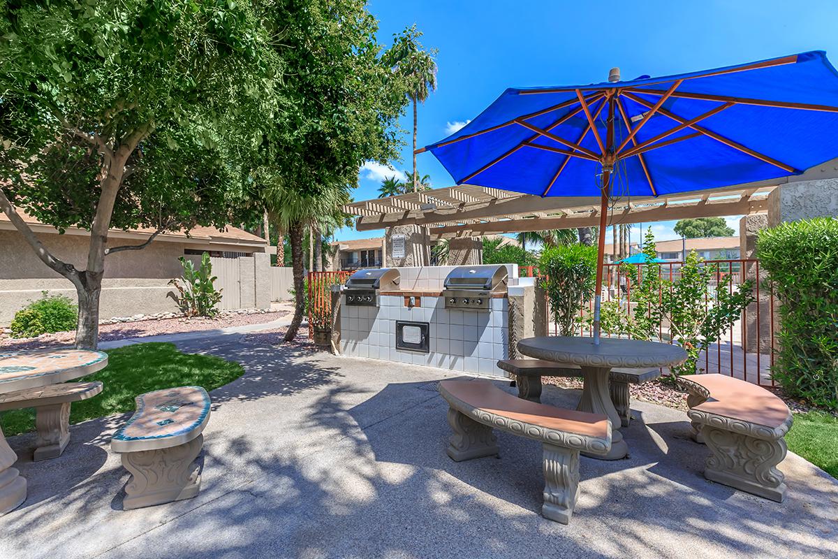 a table topped with a blue umbrella