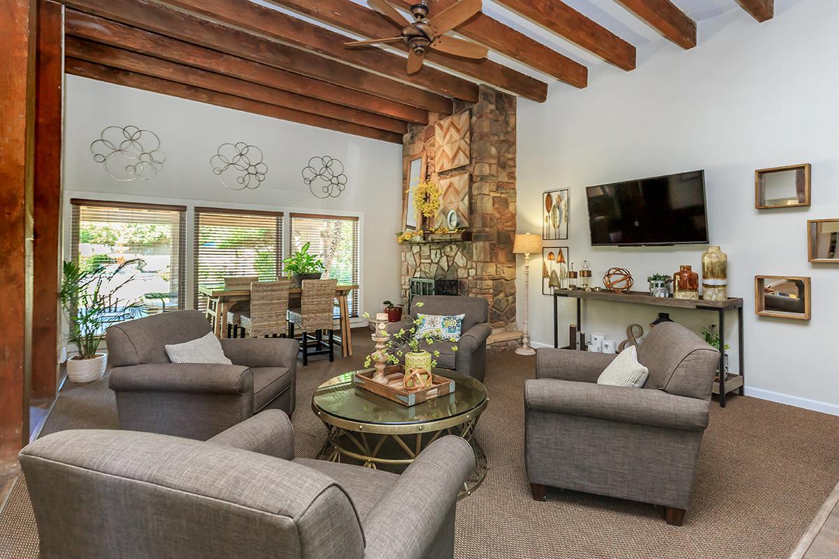 a living room filled with furniture and a fire place